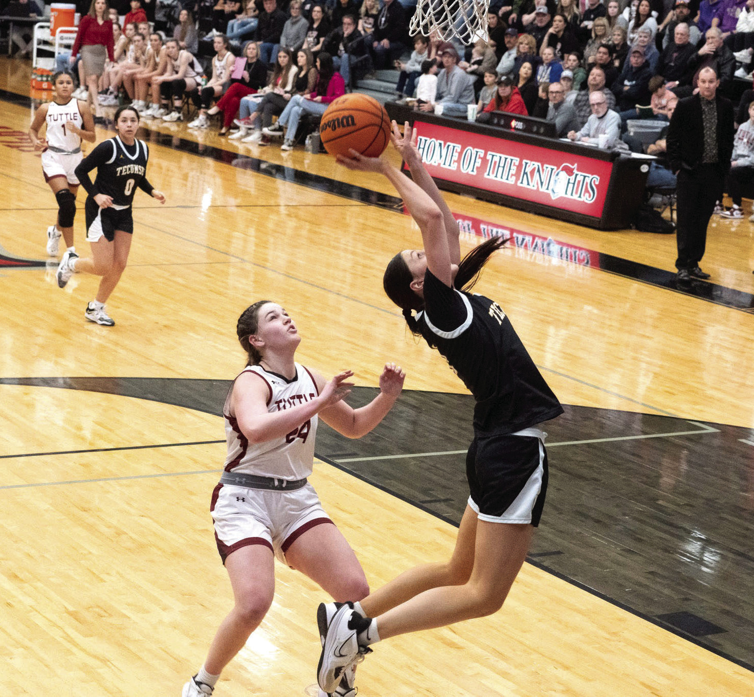 Tecumseh senior Kenzli Warden shoots from under the basket during the Class 4A Regional game against Tuttle, at Crossings Christian on Feb. 25. The Lady Savages lost to Tuttle, 19-40, but in their first Regional game, Feb. 23, they won with Broken Bow, 59-26. They advance to Area play today (March 2) in Henryetta. Photo provided by Kenetta Lisenbee.