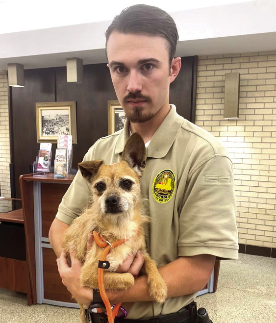 Officer Meyers gave the monthly Shawnee Animal Shelter report and showed off Teeny, a two-year-old male Wheaten Terrier mix up for adoption. Photos by Julie Talton, Countywide & Sun