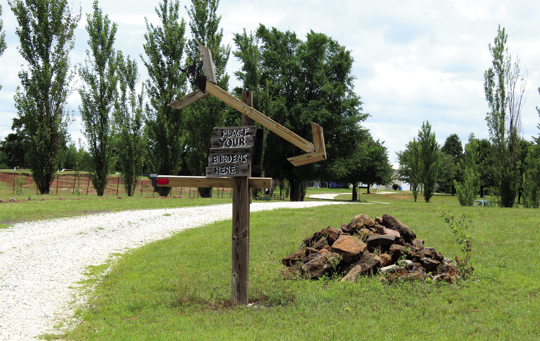 A sign along the entryway to Serenity Hollow Retreat Center says 'Place you burdens here,' and the opposite side says 'Leave your burdens behind.' The 40-acre women's retreat is located at 20425 Kings Road and offers well-being workshops, walking trails, four themed bedrooms with adult bunk beds and an outdoor event area, as well as goats, donkeys and two dogs. Natasha Dunagan, Countywide &amp; Sun