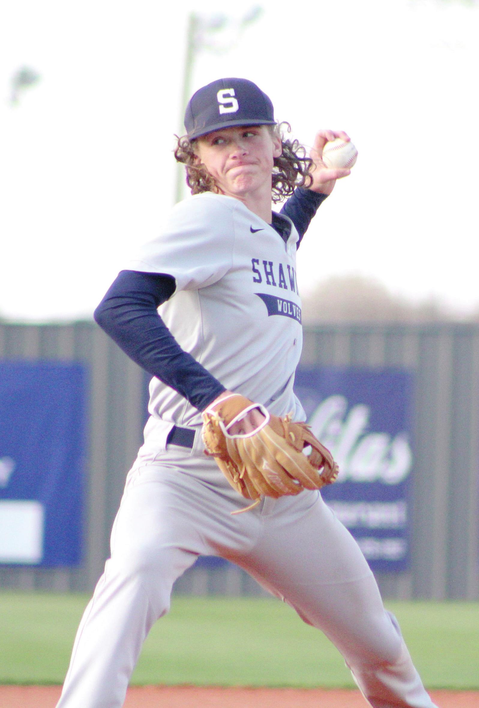 Shawnee junior Preston Tully winds up a pitch in the home game against Bishop McGuinness during the Bill Tipton Classic on April 7. Shawnee lost that game, 8-10, but they came back on April 8 to win against Del City, 15-4. Countywide &amp; Sun/Natasha Dunagan