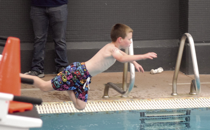 The final stage of the Healthy Kids Day Triathlon was a four lap swim in the pool. Landon Williams, age 9, from Bethel, was quick to jump in.