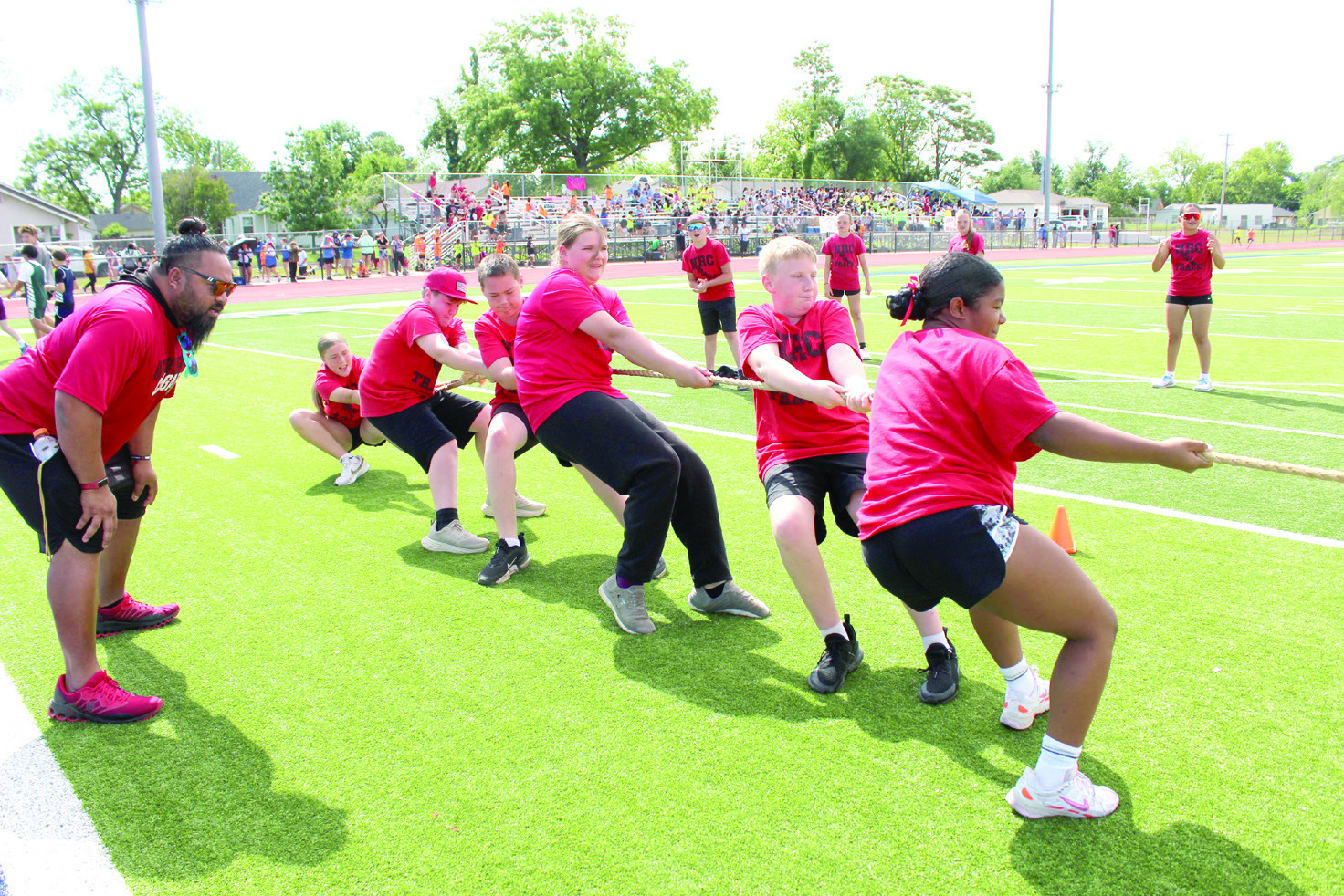 North Rock Creek football and Special Olympics coach Joe Schwabe cheers on his tug-o-war team as they pull against South Rock Creek in the Kiwanis Little Olympics championship on May 5 at Jim Thorpe Stadium. Natasha Dunagan, Countywide & Sun