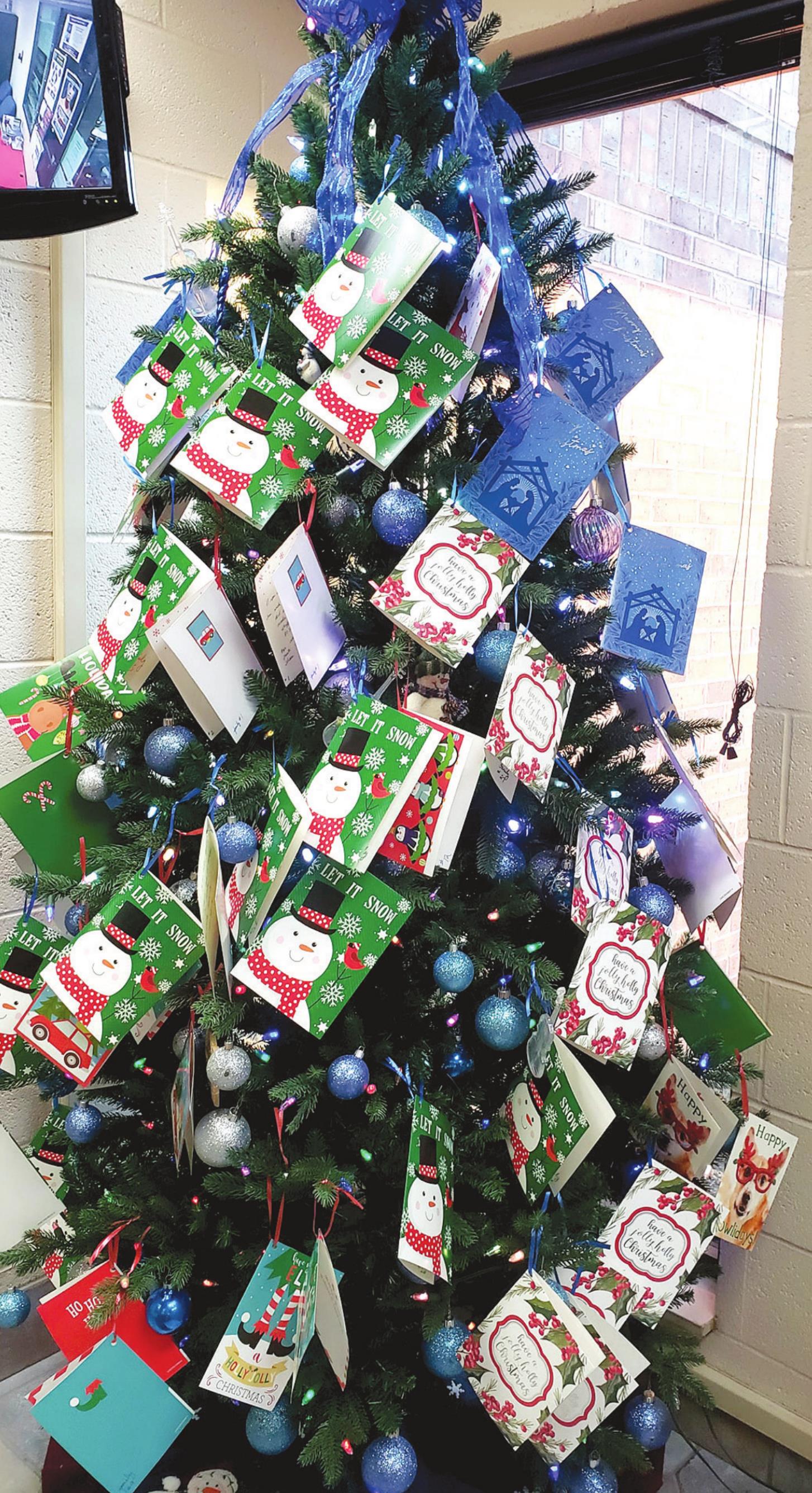 The Bows of Love tree filled with lists for local children was in the lobby of the Tecumseh Police Department last year. This year’s tree should have the lists ready Monday, Nov. 29, for those who would like to participate in 2021. File photo