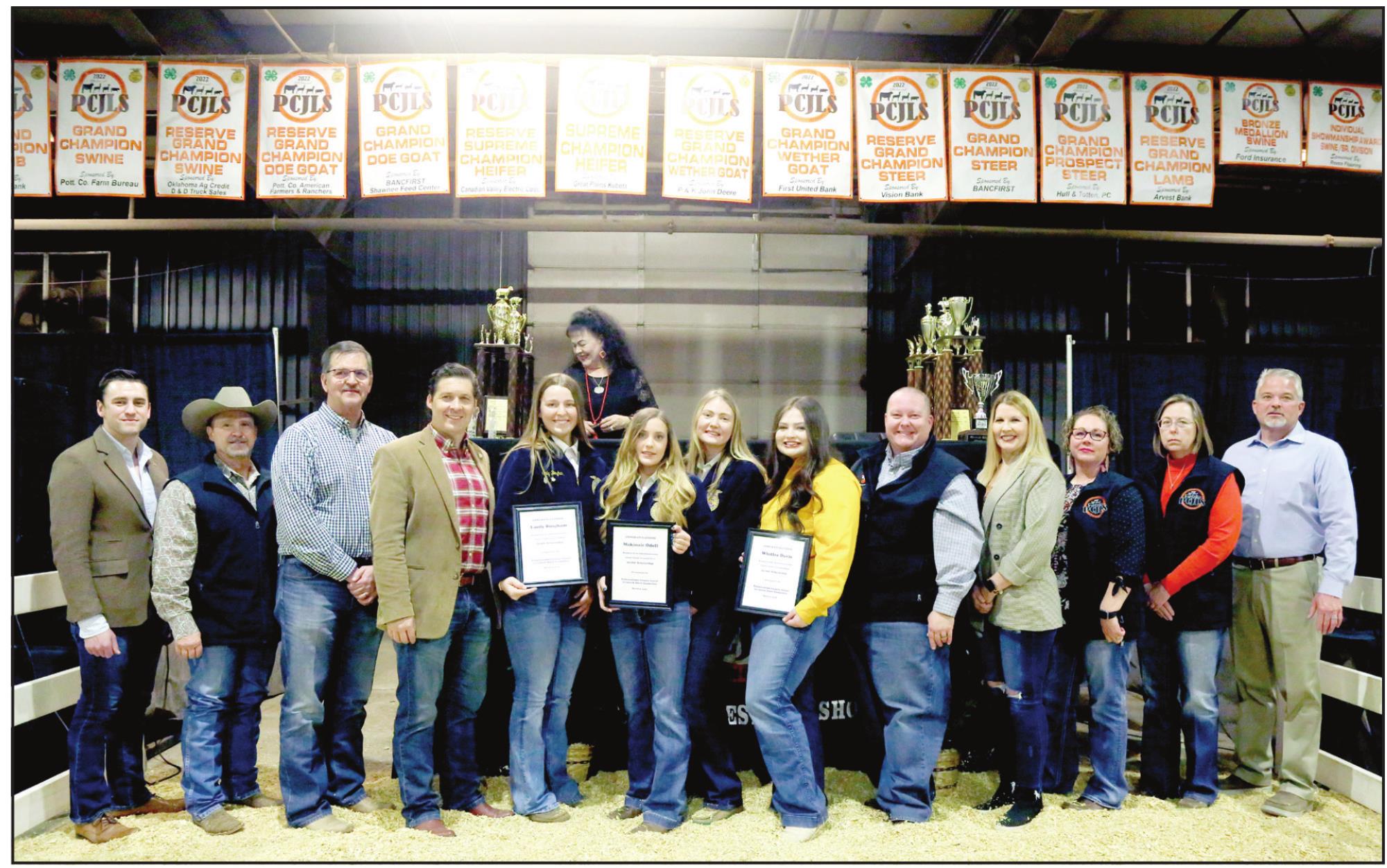 Four high school seniors were aeach warded $2,000 scholarships at the PCJLS Premium Auction. Pictured from left: Matt Blubaugh with the office of US Rep Stephanie Bice , Rep. Danny Sterling, Rep. Ronny Johns, Sen. Shane Jett, Emily Bingham - Tecumseh FFA, Makinzie Odell - Asher FFA, Allie Brown-Asher FFA, Whitlee Davis, - Tecumseh FFA, Rep. Dell Kerbs, Dist. 1 Pottawatomie County Commissioner Melissa Dennis, Mandy Hasbell, Gina Rounsaville, and Jeremy Frye.