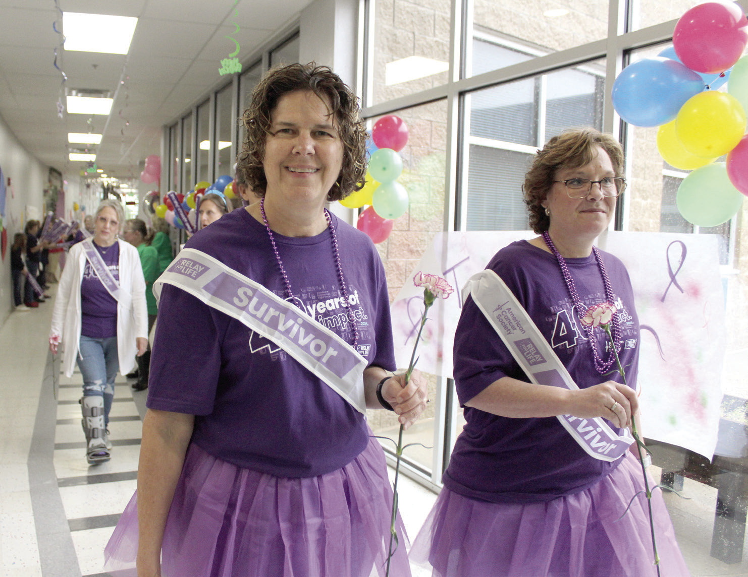 Cancer survivors Tina Thompson and Tiffany O'Neal walk the first lap of Relay for Life, held at Shawnee Early Childhood Center on the afternoon of April 26. Natasha Dunagan, Countywide & Sun