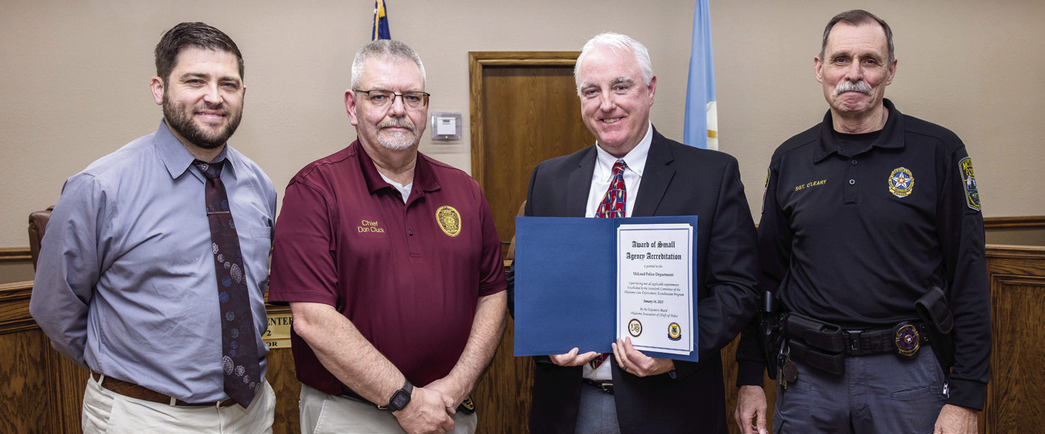 McLoud Police Department received its accreditation certificate. Pictured from left are McLoud Mayor Daniel McClure, Tuttle Police Cheif Don Cluck, McLoud Police Cheif Kyle Webb and McLoud Police SGT. Michael O'Leary. Photo courtesy of Monica Poindexter