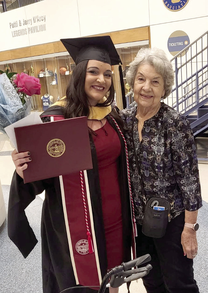 Kayxandra (KC) Campbell (left) celebrates earning her master’s degree in social work with her Granny, Joyce Stiles. Campbell took the helm as executive director of the Child Advocacy Center of Central Oklahoma (CACCO) just months before graduating. Photo provided