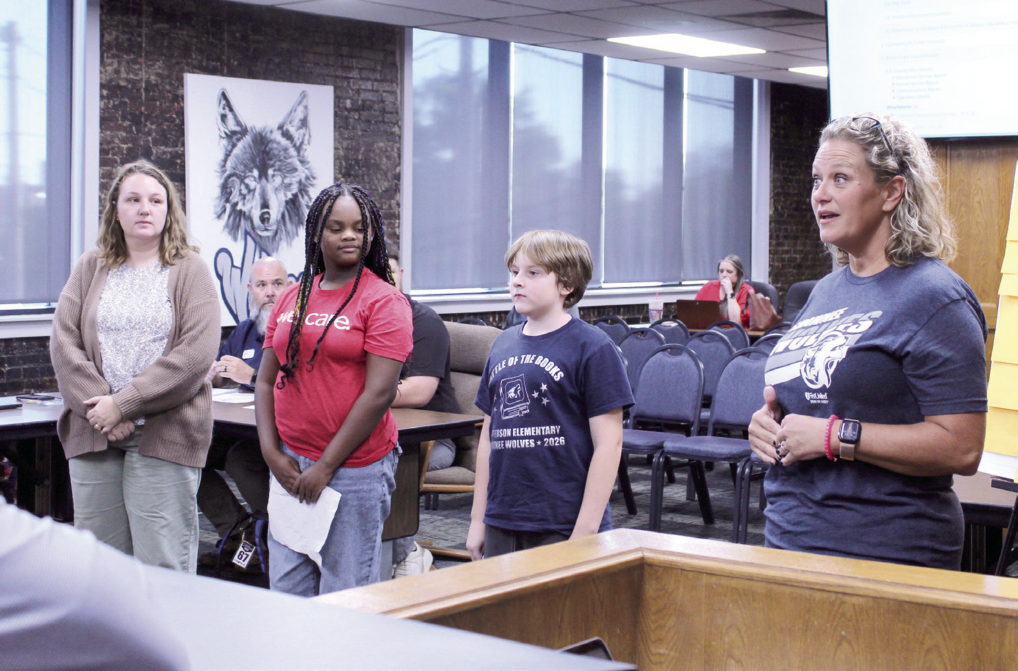 Jefferson Elementary Principal Jennifer Epperley speaks with the Shawnee Board of Education during the Oct. 5 meeting, as Instructional Coach Katelyn Miears , Nedra Edwards and Isaiah Peters look on. They led the flag salutes and invocation and also led the Board in a math-based game of 'I'm Thinking of a Number.' Natasha Dunagan, Countywide &amp; Sun