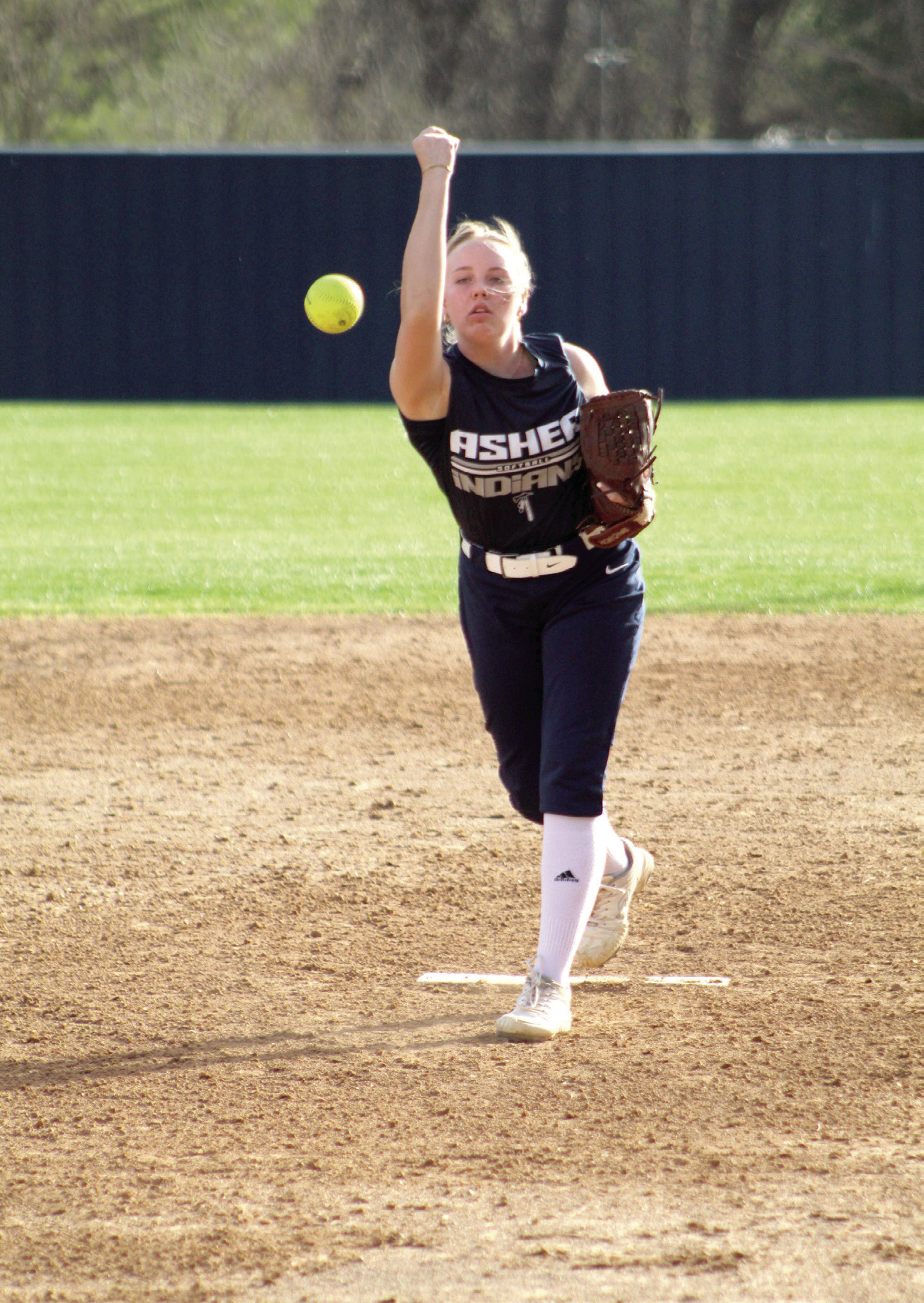 Asher freshman Preslee Taylor hurls the ball over home plate in the fifth inning of the home game with Varnum on March 31. The Lady Indians won, 4-2. Countywide & Sun/Natasha Dunagan