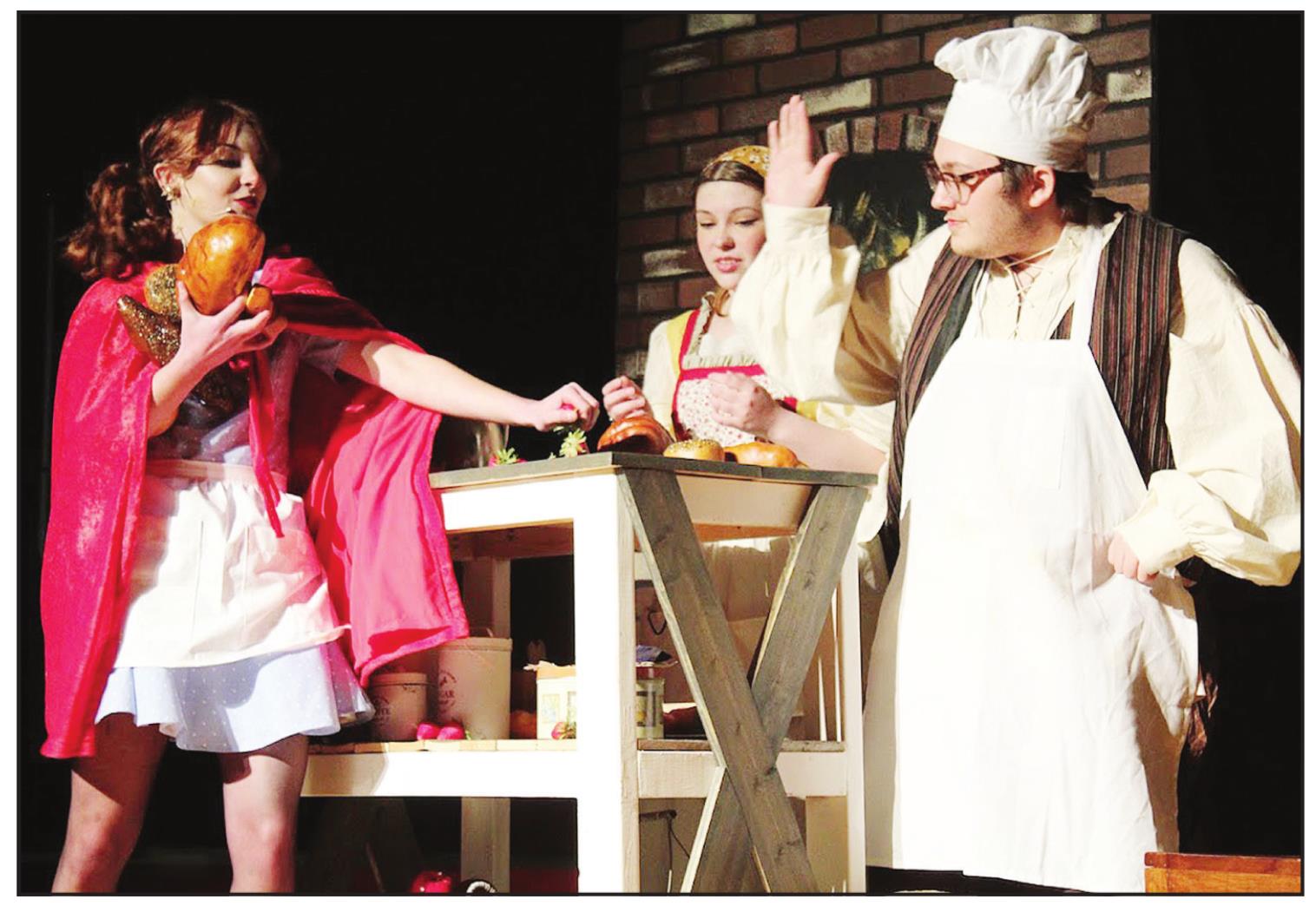 Little Red Ridinghood (Makenzi Stiles), Baker’s Wife (Lillian Effinger), and Baker (Jadon Jackson) rehearse for Tecumseh Vocal Music Program’s production of ‘Into the Woods Jr.’ Performances will be held at the Tecumseh High School Alumni Center, April 7-8. Countywide &amp; Sun/Natasha Dunagan