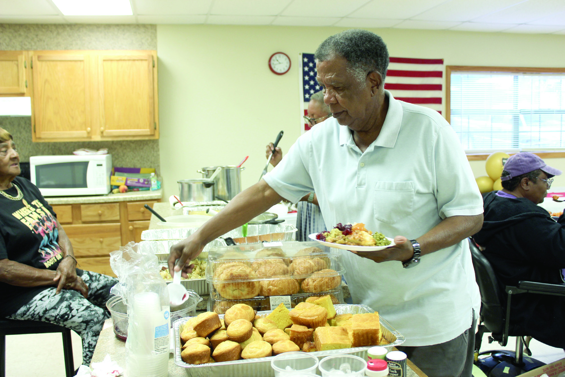 Bobby Jackson, who was originally from Brooksville and now lives in Midwest City, serves himself during the Brooksville 122nd Anniversary Celebration, held at the Brooksville Community Center on Oct. 18. Brooksville is one of the remaining 13 all-black towns in Oklahoma, out of an original 50-plus, according to the Oklahoma Historical Society website. It was originally named Sewell, but was renamed in 1912 after A.R. Brooks, a cotton buyer and farmer. Full cutline below. Natasha Dunagan, Countywide & Sun