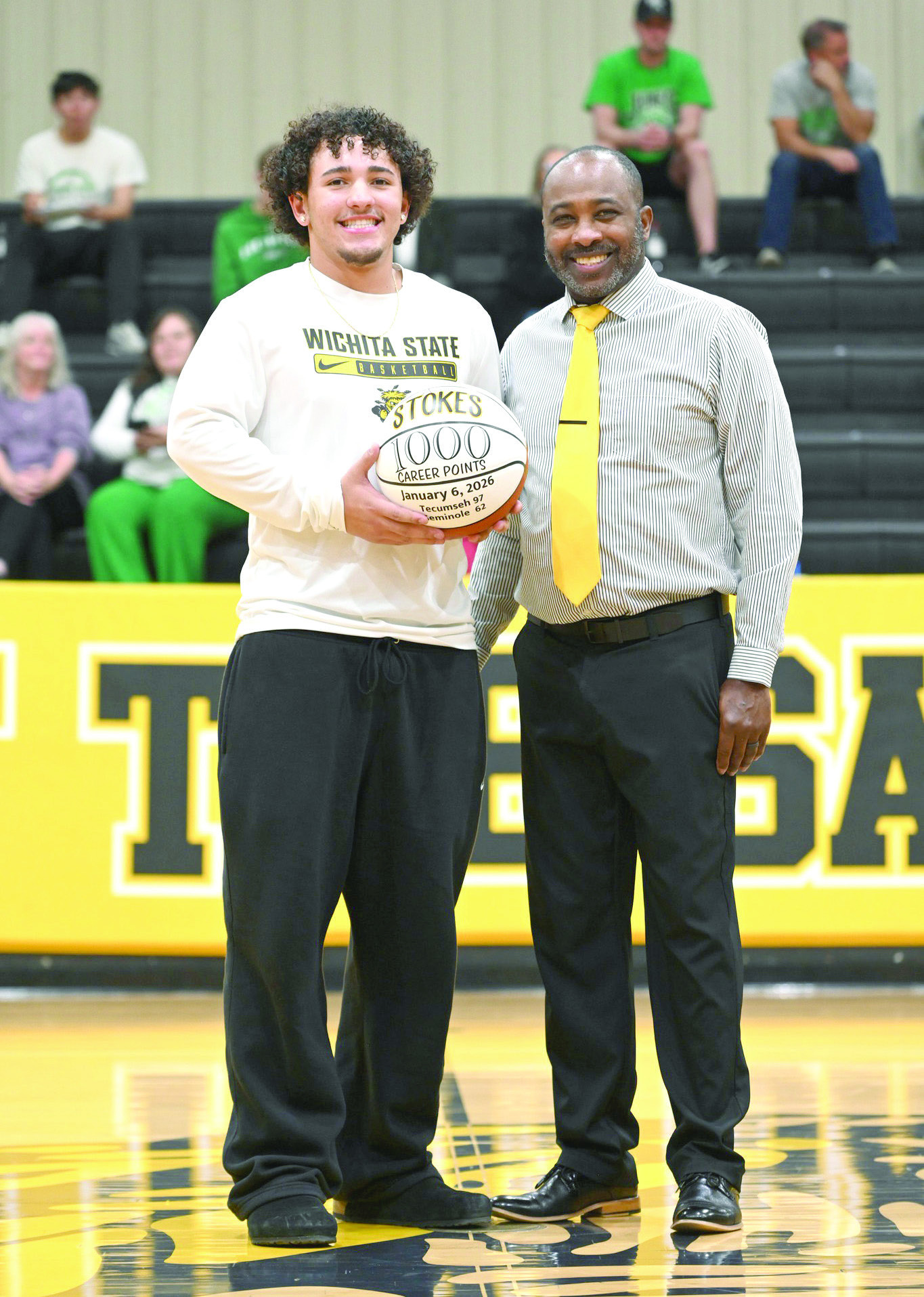 Tecumseh senior Aveon Stokes receives a game ball from Head Coach Bryant Edwards at halftime of the Lady Savages home game on Jan. 13. The ball was in honor of Stokes reaching 1,000 career points during the home game against Seminole on Jan. 6. Photo courtesy of Kenetta Lisenbee