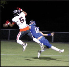 Bethel senior Reagan Curry (#10) tries to catch a pass, as Meeker junior Manny Saavedra (#5) intercepts it, during the third quarter of the Sept. 22 Bethel district home game. Meeker won, 46-7. Countywide &amp; Sun/Natasha Dunagan