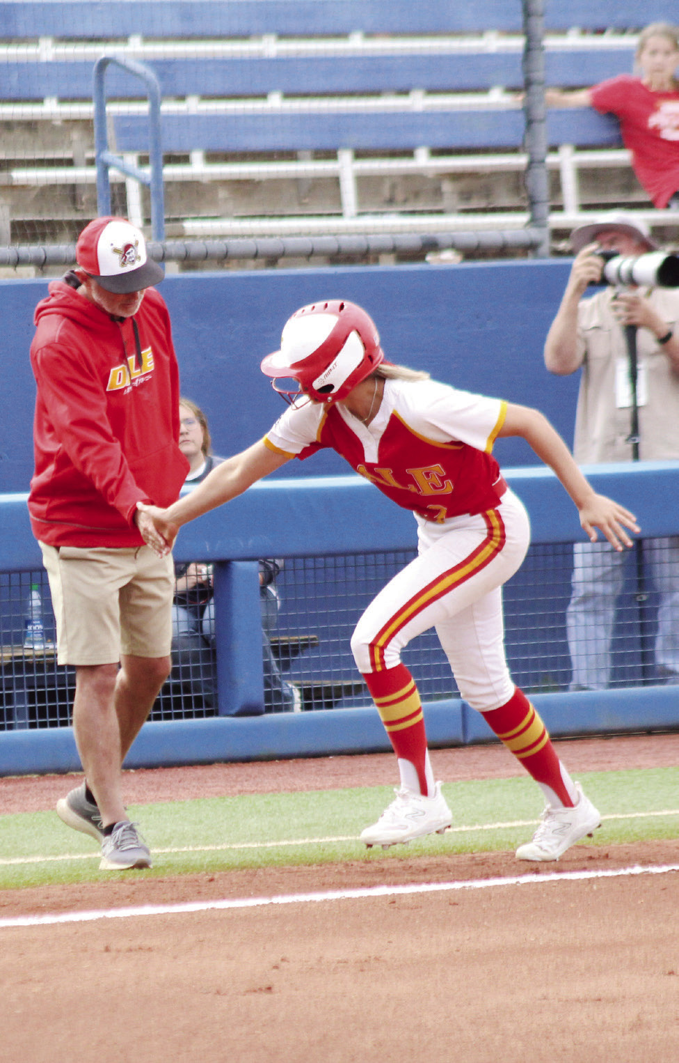 After hitting a home run, Dale senior Chayse Caram gets five from Coach Andy Powell as she rounds third base in the first inning of the Class 3A State Tournament Finals against Caddo on May 3. Countywide & Sun/Natasha Dunagan