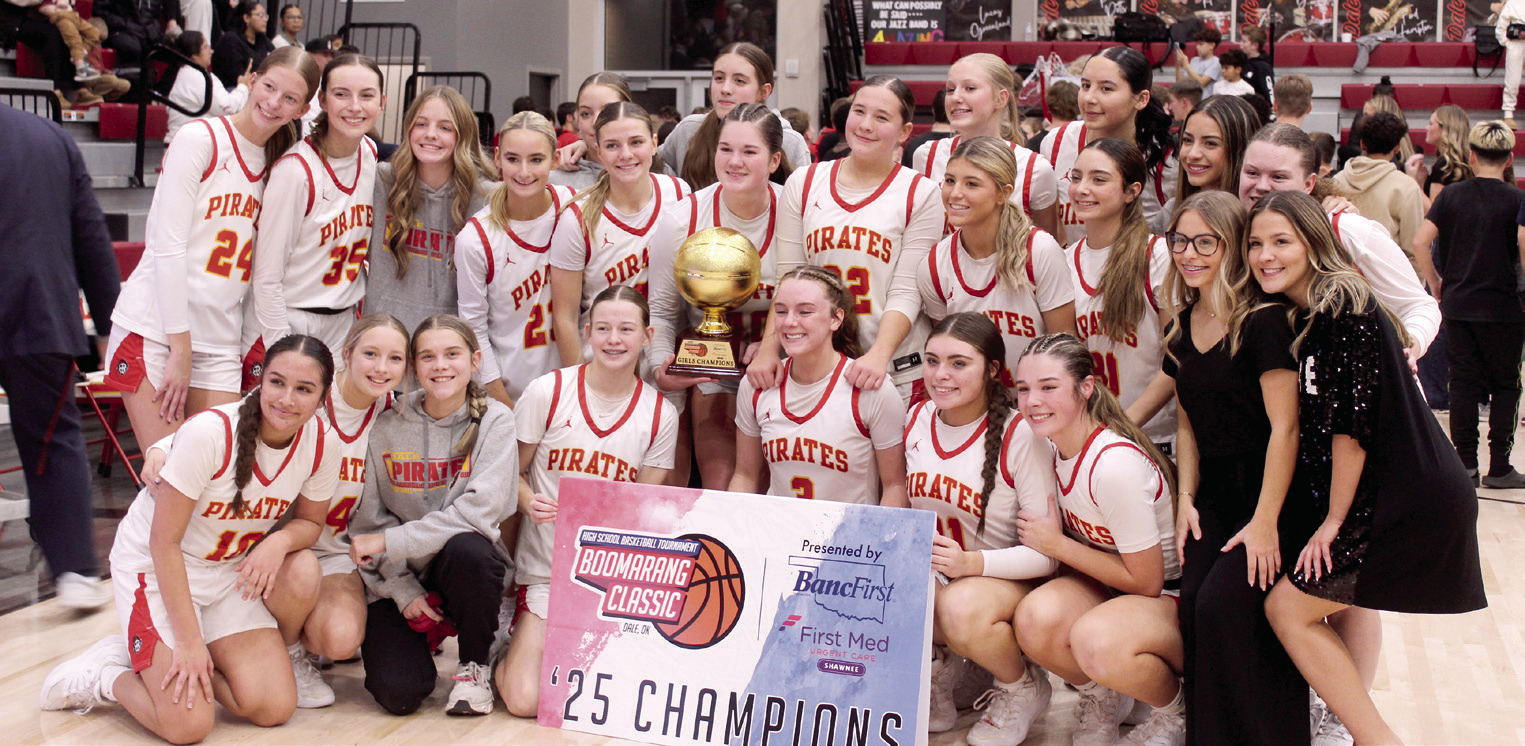The Dale Lady Pirates pose with their trophy after winning the Dale Boomarang Basketball Classic on Dec. 13. Over the three-day tournament, they won all three games: Mustang JV, 77-32; Alva/Freedom, 53-44; and, Washington, 75-69. Their head coach is Eric Smith. Photos by Natasha Dunagan, Countywide &amp; Sun