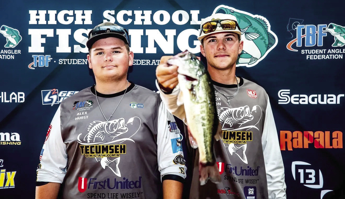 Tecumseh High School incoming junior Alex Hurst and 2026 graduate Maddox Dickson pose with one of the bass they caught in the recent 17th Annual SAF HS Fishing National Championship and World Finals in Kentucky. Photo provided