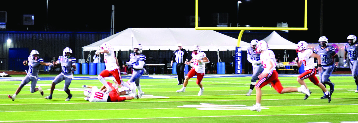 Braylon Lassiter makes the run for a first down in the Halloween home game against Bishop Kelley. The Wolves were tied until the last few seconds when the Comets kicked a field goal for the 27-30 win. Julie Talton, Countywide &amp; Sun