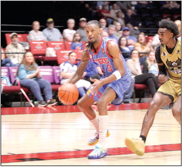 Potawatomi Fire Forward Ricky Artis II drives to the hoop. Photos by Natasha Dunagan, Countywide & Sun