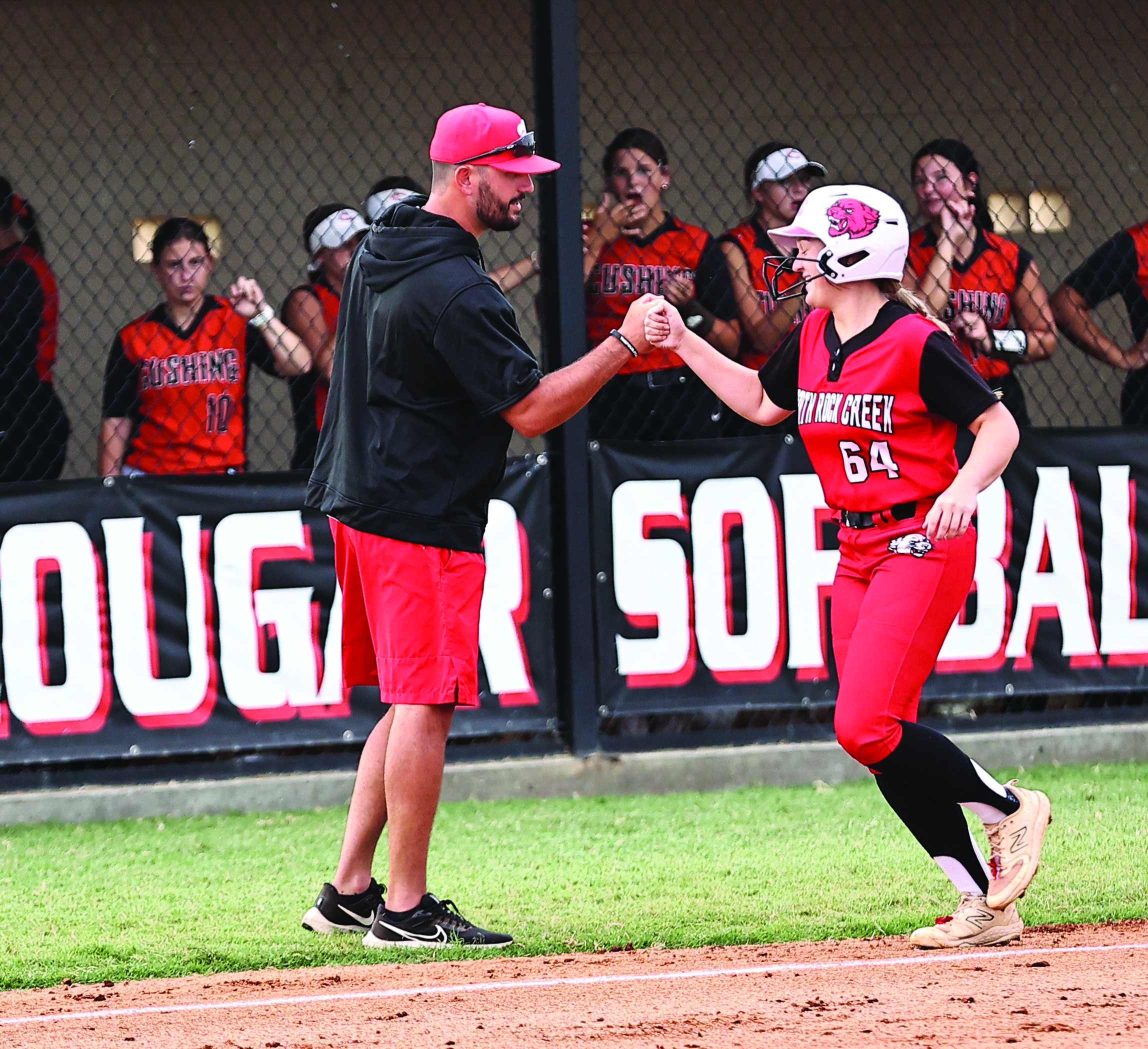 Pictured right, North Rock Creek’s Ashlyn Bade celebrates with Coach Griffin after she hits a homerun. Photo courtesy of Gowin Photography