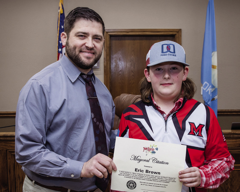 McLoud Mayor Daniel McClure presents Mayoral Citation to McLoud High School Student Eric Brown. Photo courtesy of Monica Poindexter