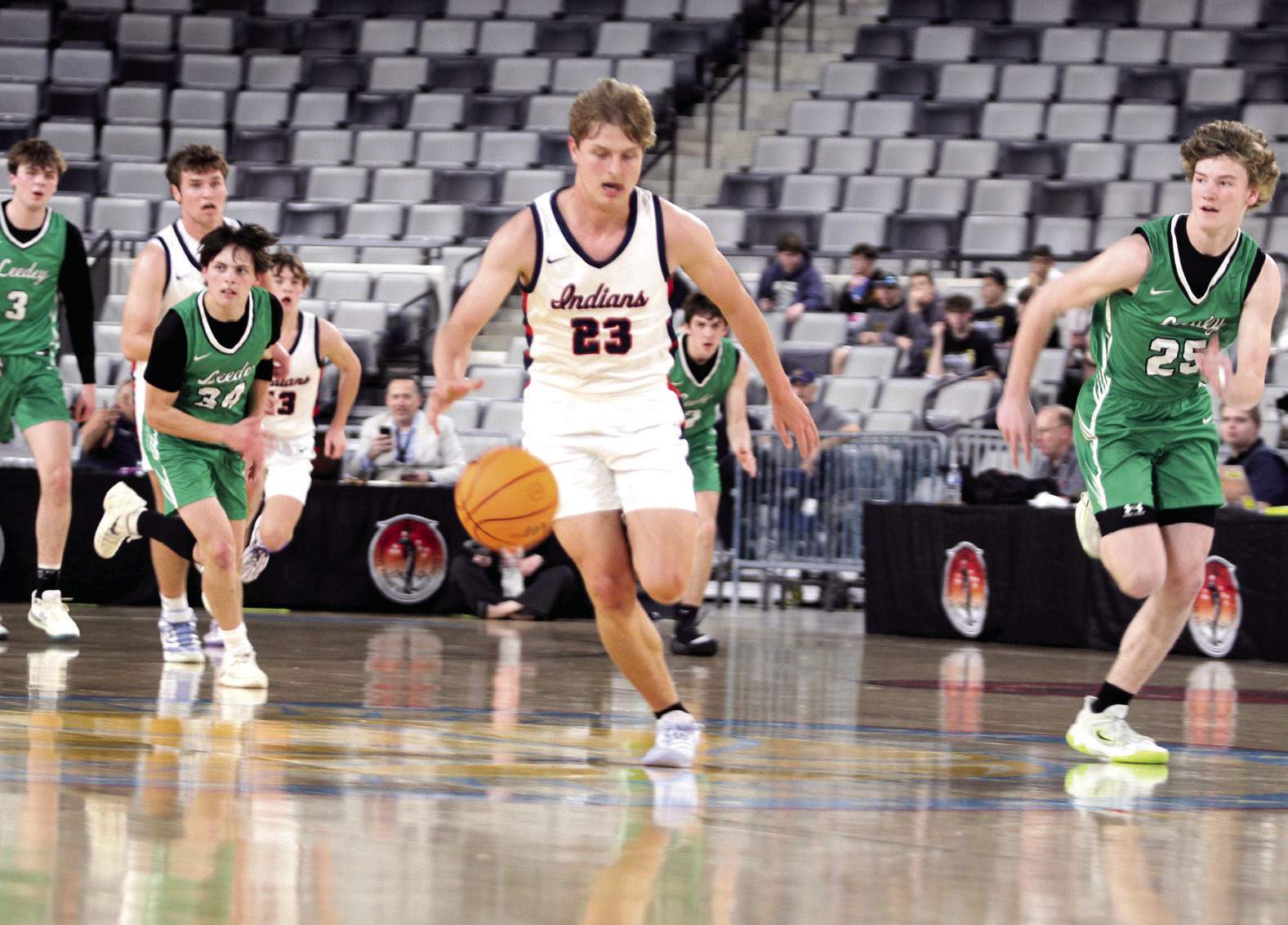 Asher's Andrew Overstreet takes it up-court before adding two points in the first quarter of the Class B2 State Quarterfinal game against Leedey on March 3 at the OG&E Coliseum in OKC. The Indians lost, 42-52, and they end their season with a record of 24-7. Click on the camera banner ad below to see all the photos. Photos by Natasha Dunagan, Countywide & Sun