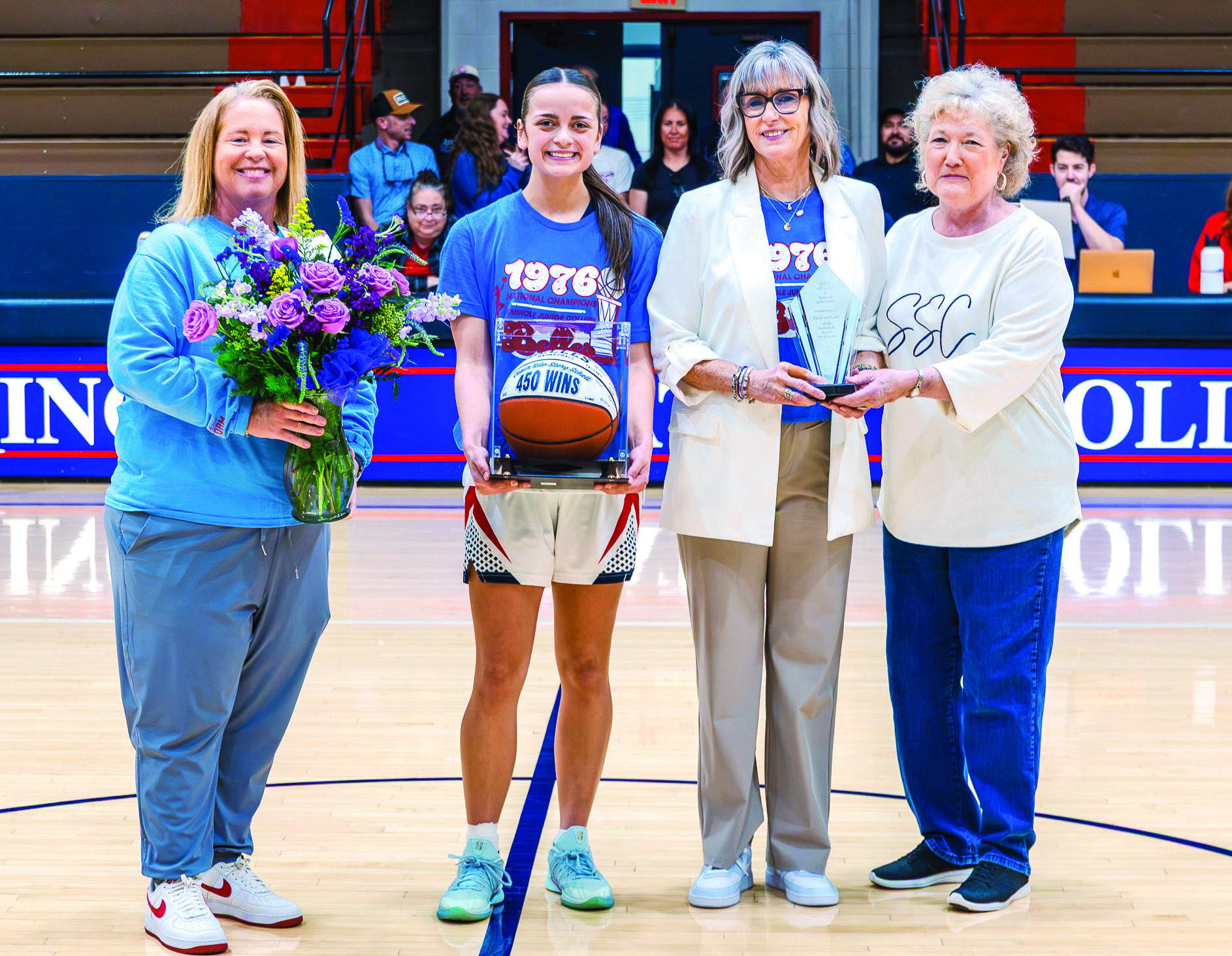 Seminole State College Women’s Basketball Head Coach Rita Story-Schell was honored during the Belles’ home game Monday, Feb. 16, after earning her 450th career win with a Feb. 12 victory over Western Oklahoma State College in Altus. Pictured (left to right): Athletic Director Leslie Sewell, sophomore forward Alona Cooper-Rochovitz, Story-Schell and SSC President Lana Reynolds. Photo Provided