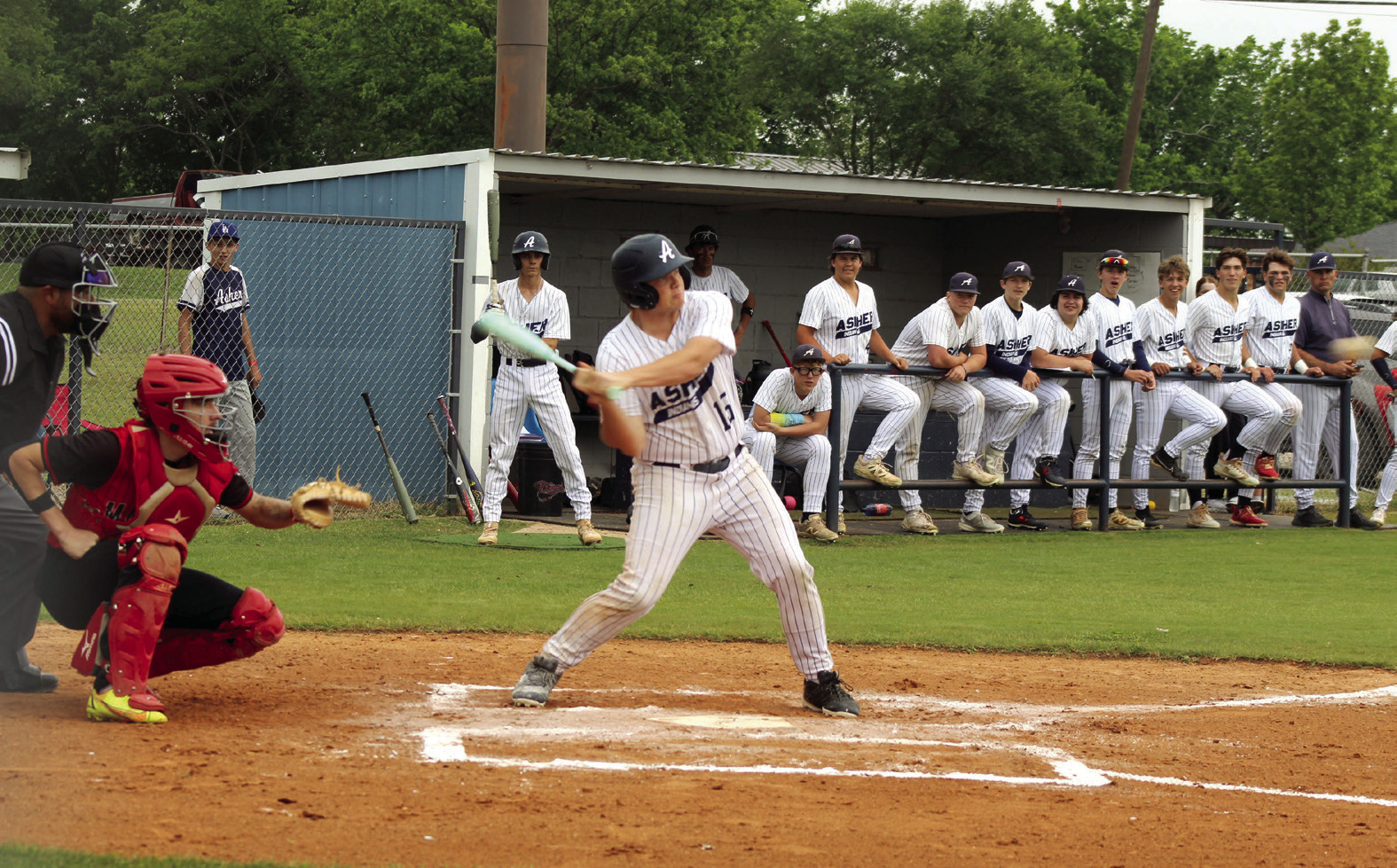 Asher sophomore Daniel Vance tags a triple during the first inning of the Class B District Baseball Tournament home game against Macomb on April 22. Also shown is Macomb catcher, senior Radlee Blaine. The Indians won both games that day, 26-0 and 20-0, to become District Champions. Photos by Natasha Dunagan, Countywide & Sun