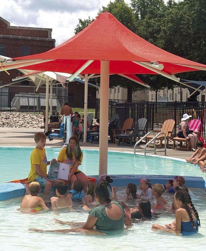 Pictured leading story time at Splash this summer are Youth Volunteers Litton Stone and Ellie Welch. Photo Provided
