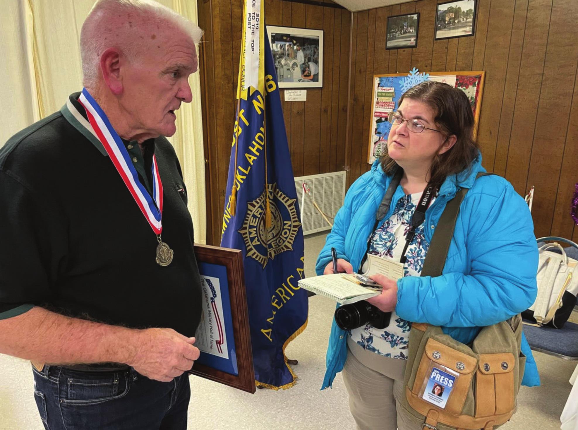 Natasha Dunagan interviews Skip Myers, for her feature article about his father TSgt. Verdun C. Myers’s induction into the Oklahoma Military Hall of Fame. Photo Provided.