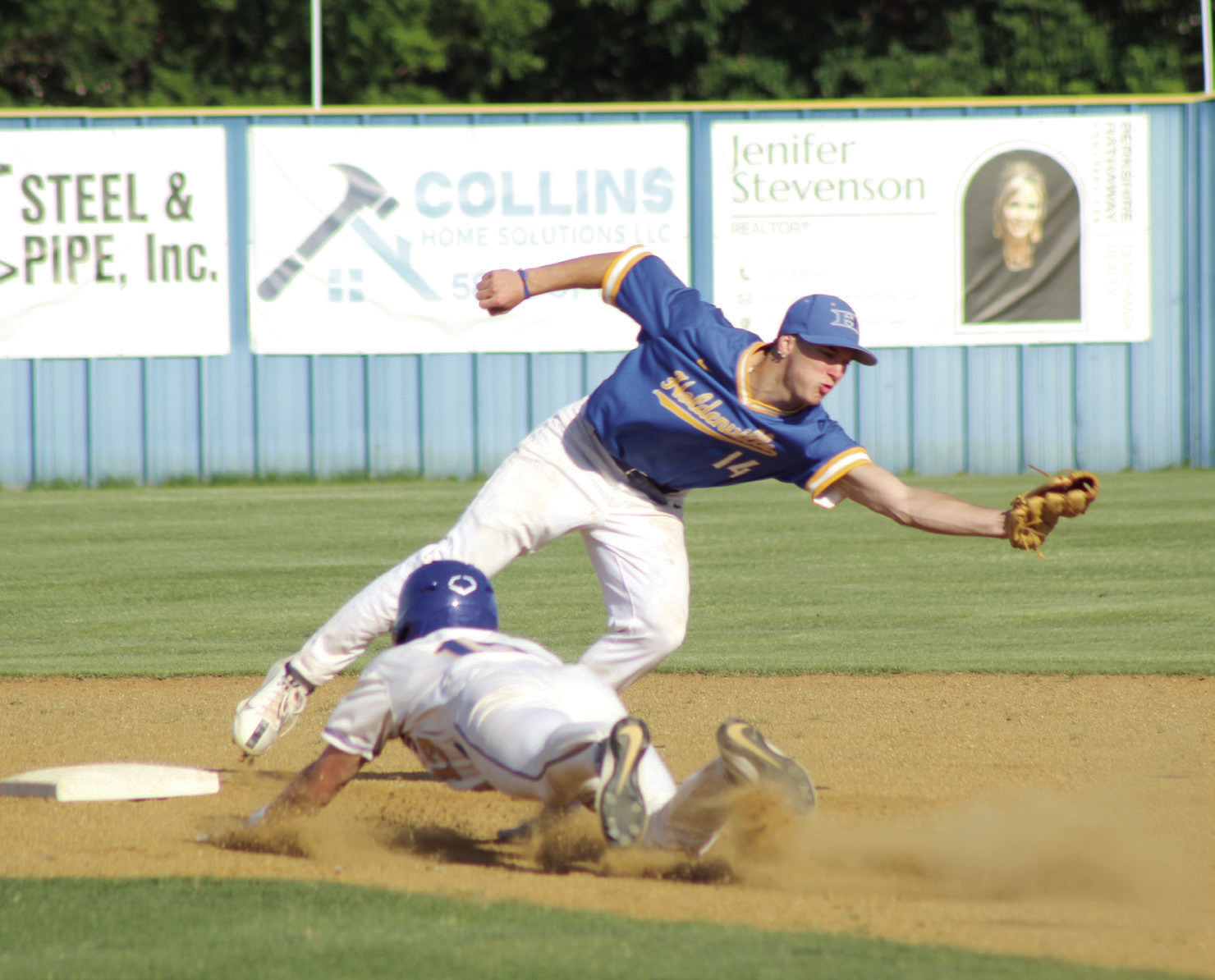 Bethel senior Zane Anderson dives to steal second as the Holdenville second-baseman reaches for the catch during the April 20 home game. The Wildcats won 11-6. Natasha Dunagan, Countywide & Sun
