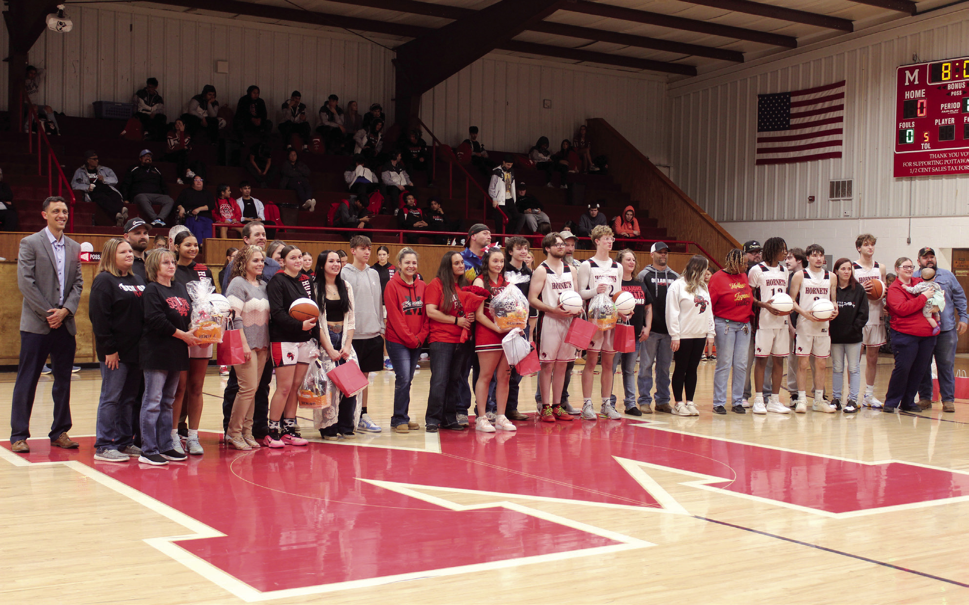 Macomb High School held their Senior Night ceremony on Feb. 10. Eight seniors in basketball and cheer participated with their families and coaches. From left, they are McKenzie Brummett, Cassi Johnson, Shyanne Wano, Trevor Laugherty, Connor Hutchins, Deandre Hendley, Radlee Blaine and Christian Binder. Photos by Natasha Dunagan, Countywide &amp; Sun