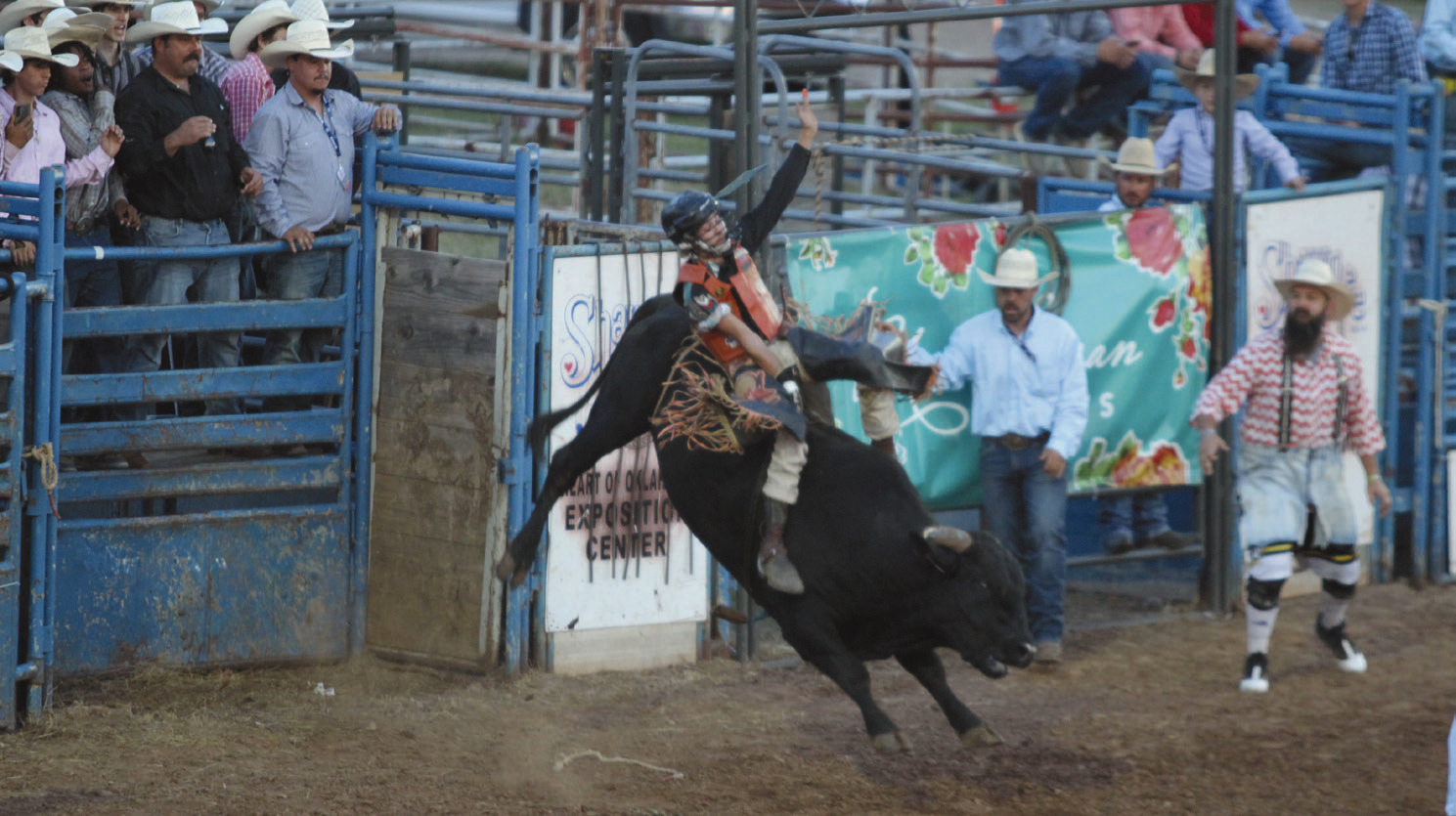 Lundan Seidl of Shawnee tries to keep his form during the International Finals Youth Rodeo opening night on July 6. Seidl has been riding bulls, like his father used to, for about a year now. Natasha Dunagan, Countywide & Sun
