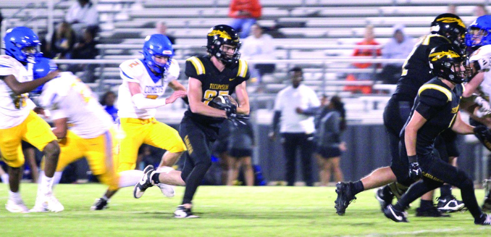 Tecumseh senior Wyatt McElfresh cradles the ball just ahead of the defense during the season-opening home game against Classen SAS at NE on Sept. 5. The Savages won, 36-8. Their next game will be tomorrow, Sept. 12, at Seminole, beginning at 7:30 pm. Natasha Dunagan, Countywide &amp; Sun
