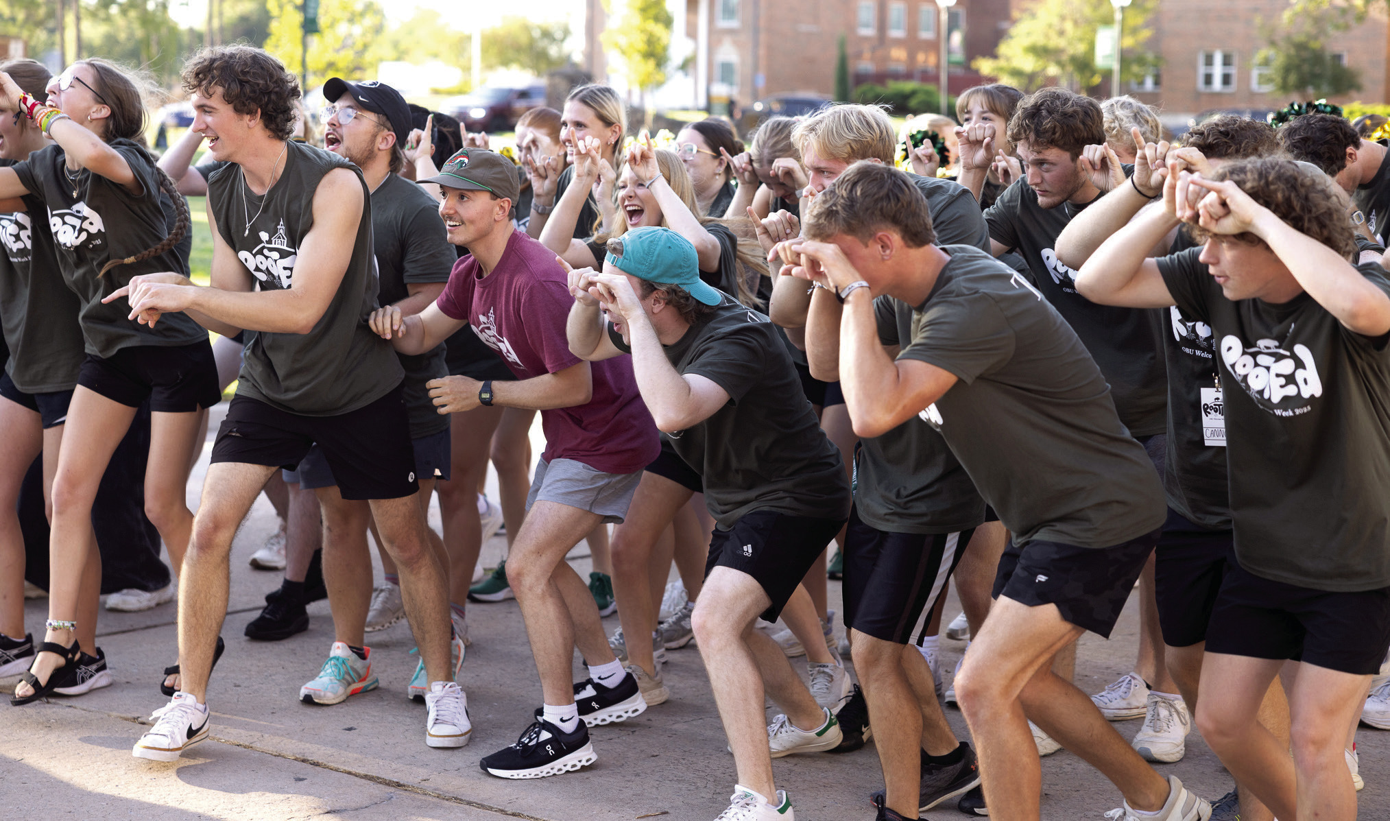 Welcome Week Workers line the curbs of campus residence centers, cheering and shaking cars as new Bison families arrive for Move-In Day at Oklahoma Baptist University, Aug. 16, 2025.