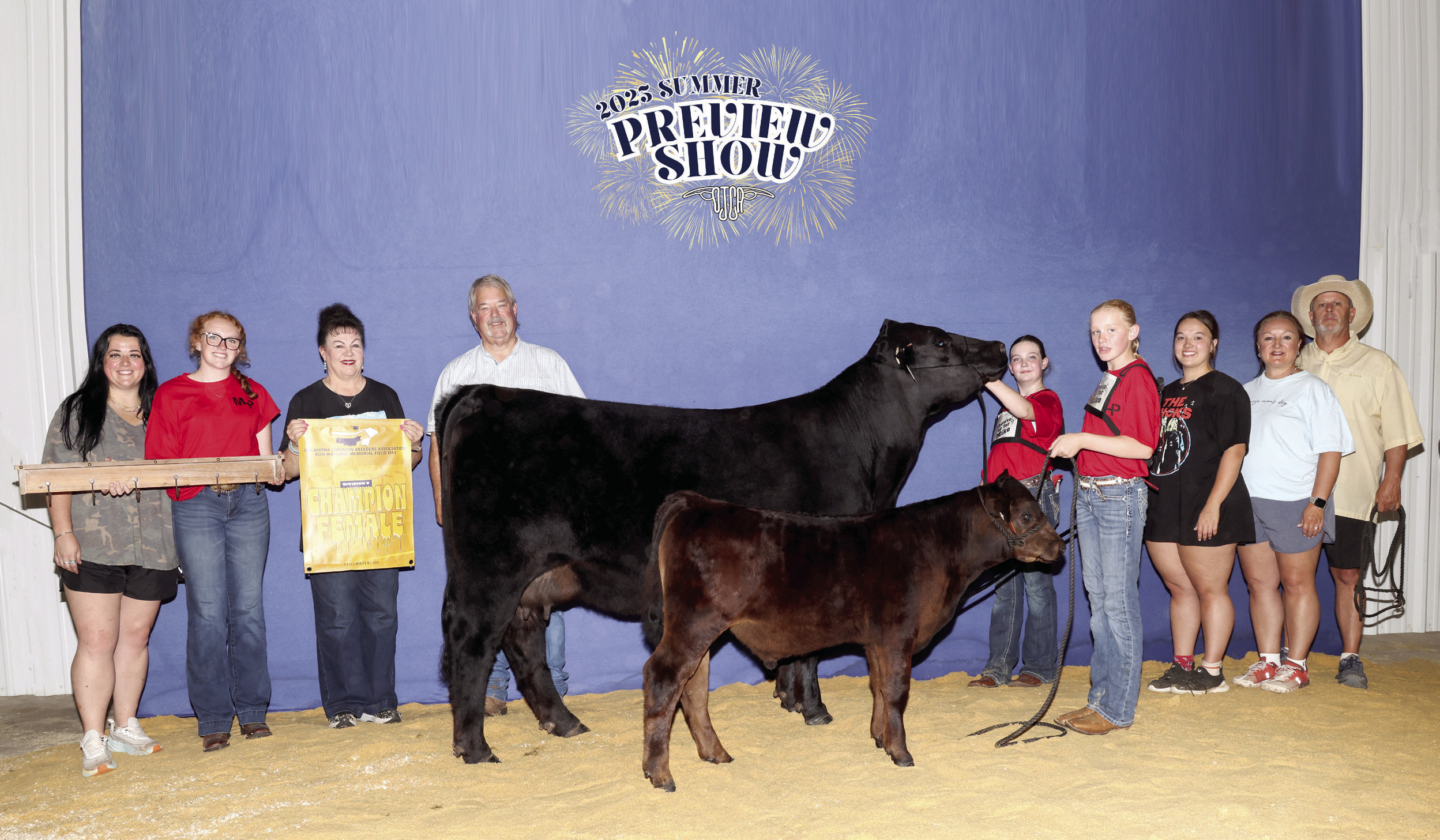 Taycie Baker placed first for her Division 5 Cow/Calf Pair of Ruby and Bubba during the 13th Annual Ron Wayland Memorial Oklahoma Limousin Field Day earlier this month. Her friend Callie Loman, both of Bethel, helped by showing the two-month-old calf. Shown, from left, are Annie Jo Gilbert, Grace Loman, Suzanne Gilbert, Randy Gilbert, Baker, Loman, Morley Griffith, Twana Griffith and Matt Griffith. Photo provided by Suzanne Gilbert