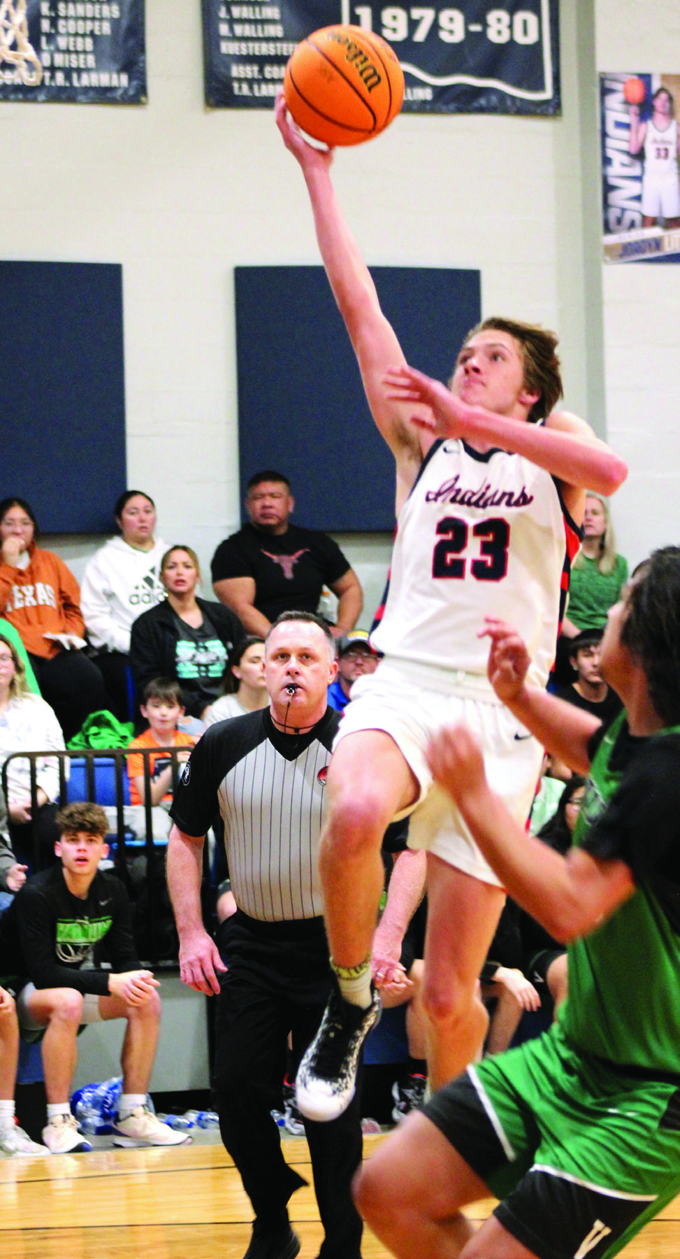 After stealing the ball, Asher’s Mikey Van-Schuyver goes for a layup and is fouled in the Jan. 2 home game with Varnum. File photo