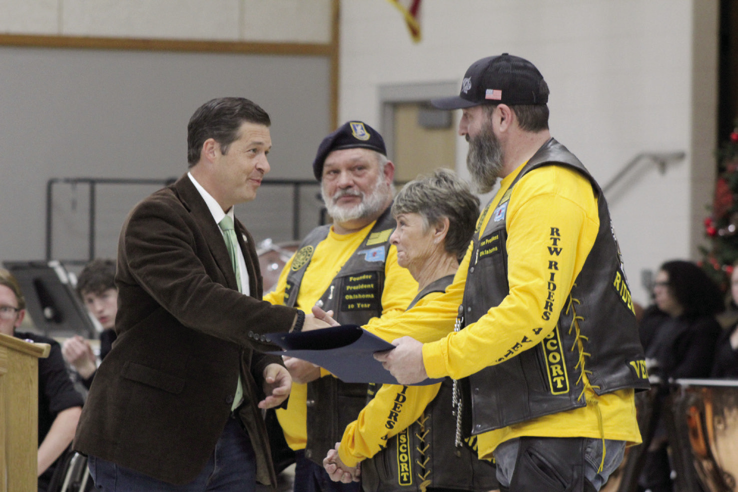 Oklahoma State Senator Shane Jett presents Citations of Commemoration to Cory “Shockwave” Stephens, the VP of Roll to Wreaths Riders 4 Vets Riding Club, far right; as well as, Club President Ralph “Rowdy” Butler and Marie “Mama Ree” Butler for their service to veterans at the National Wreaths Across America Day event in Tecumseh, Dec. 16. Countywide & Sun/Natasha Dunagan