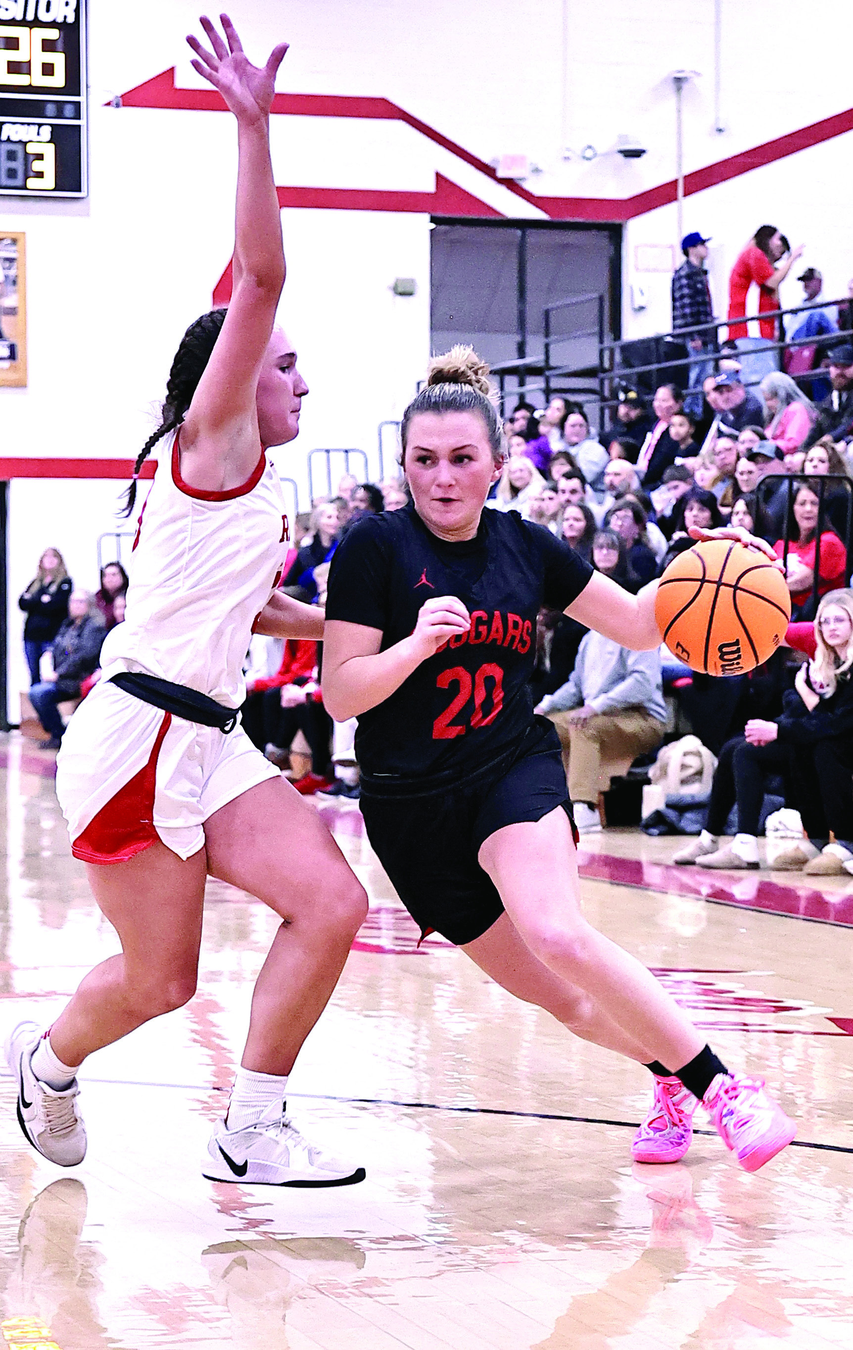 NRC's Aubree Shivelhood drives to the lane and gets fouled by the McLoud player. McLoud took the win, 62-71. Photo Provided by Gowin Photography