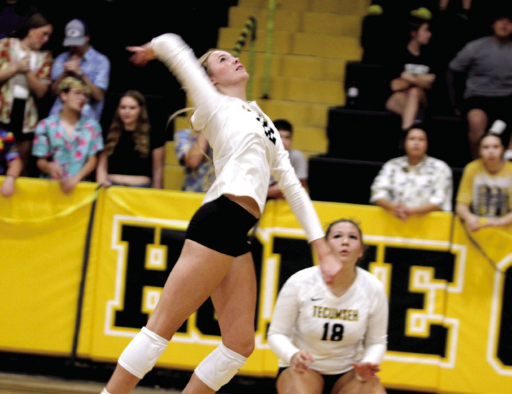 Natasha Dunagan, Countywide & Sun Tecumseh senior Kennadee Mason jumps to attack the ball during the Sr Night match with Cache on Oct. 2. Also shown is sophomore Aivah Dodgion.