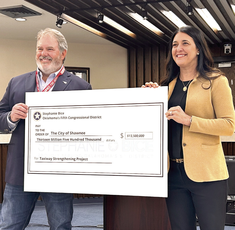 Congresswoman Stephanie Bice (right) presents a $13.5 Million check to Shawnee Mayor Eric Stephens. The Community Project Funding Grant - the largest of 15 grant requests approved for Bice - will be used to improve the runway and taxiways at the Shawnee Airport.