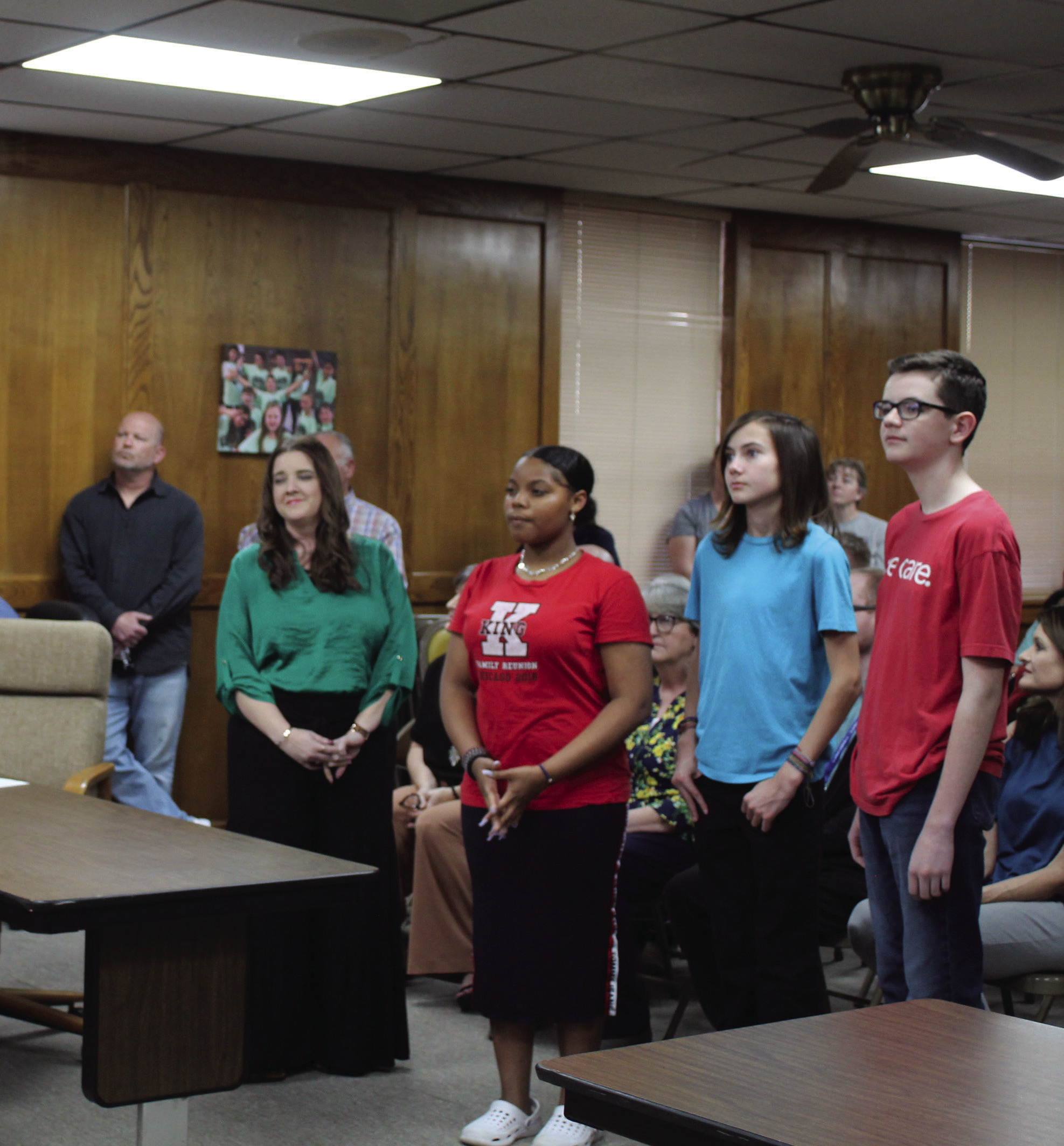 Coding teacher Krista Farris introduced three of her eighth-grade students in the new App Creator class at Shawnee Middle School, and they explained their projects to the Shawnee Board of Education, March 6. They are, from left, Amaya Townes, Duke Wright and Cooper Dunn. Countywide & Sun/Natasha Dunagan
