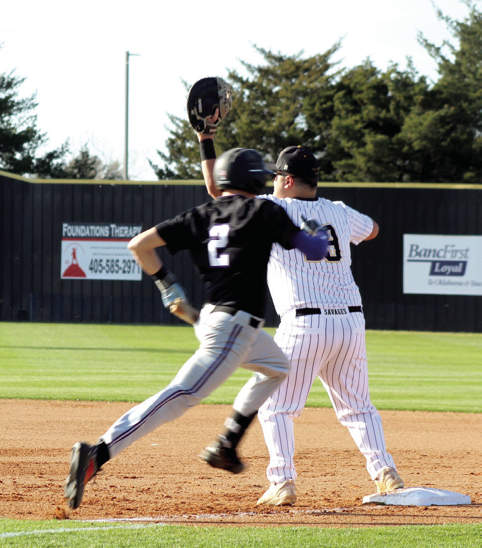 Tecumseh sophomore Major Bryant waits for the catch as a Chickasha runner approaches first during the home game on March 9. The Savages lost 0-11. Tecumseh Photos by Natasha Dunagan, Countywide & Sun