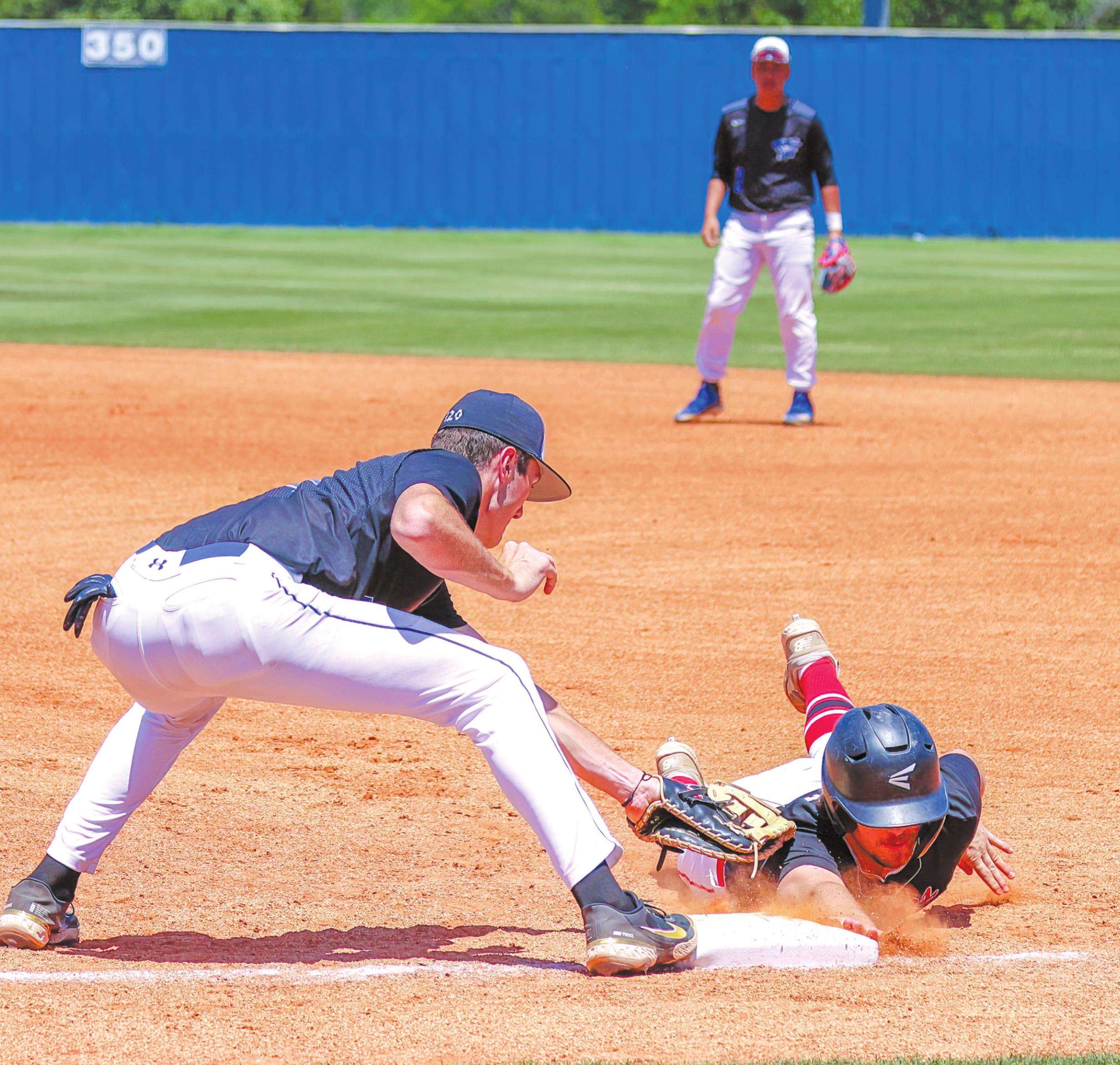 Bethel junior Bronc Robbins tags a runner just as he touches first base during the Class 3A State Baseball Tournament at Choctaw High School on May 12. Bethel lost against Keys (Parkhill), 8-16, after five straight wins in the Districts and Regionals. Photo provided by Richelle Treece.