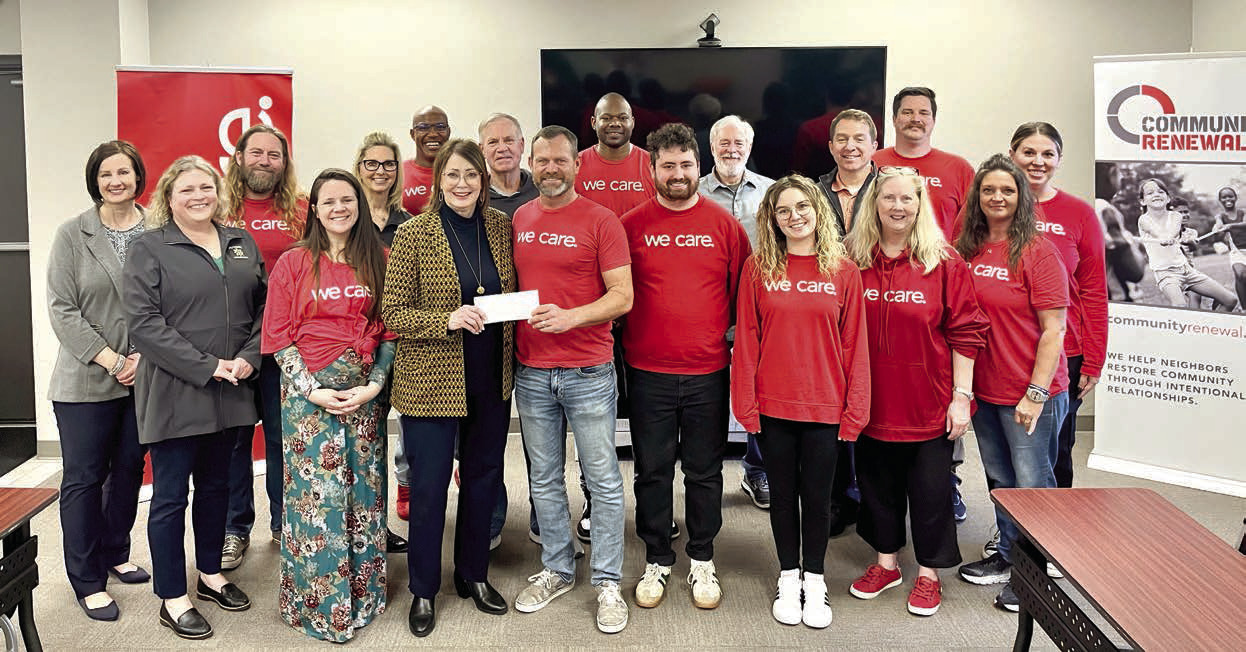 Kathy Laster, Ph.D. President &amp; CEO Avedis Foundation, presents a check to Community Renewal Executive Director Brandon Dyer while staff and Avedis board members join in for the presentation. Photo provided