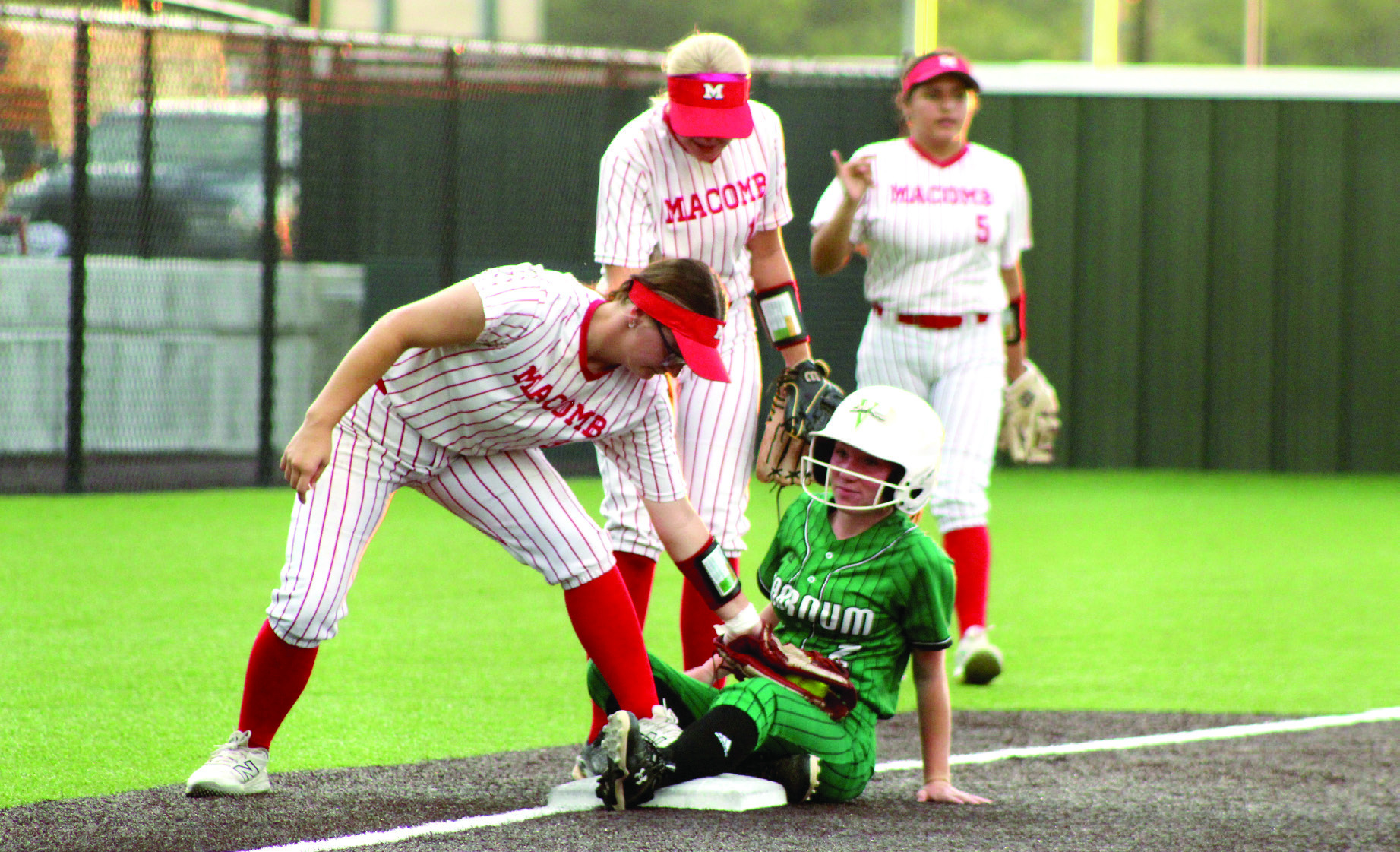 Macomb senior Deja Givens tags a Varnum runner, who was controversially declared safe, at third base during the Little River Conference Tournament game at FireLake Ball Fields on Sept. 10. Macomb lost in overtime, 2-3. The Lady Hornets lost three games and won one - against Maud-Sasakwa, 16-4 - in the three-day tournament. Photos by Natasha Dunagan, Countywide & Sun