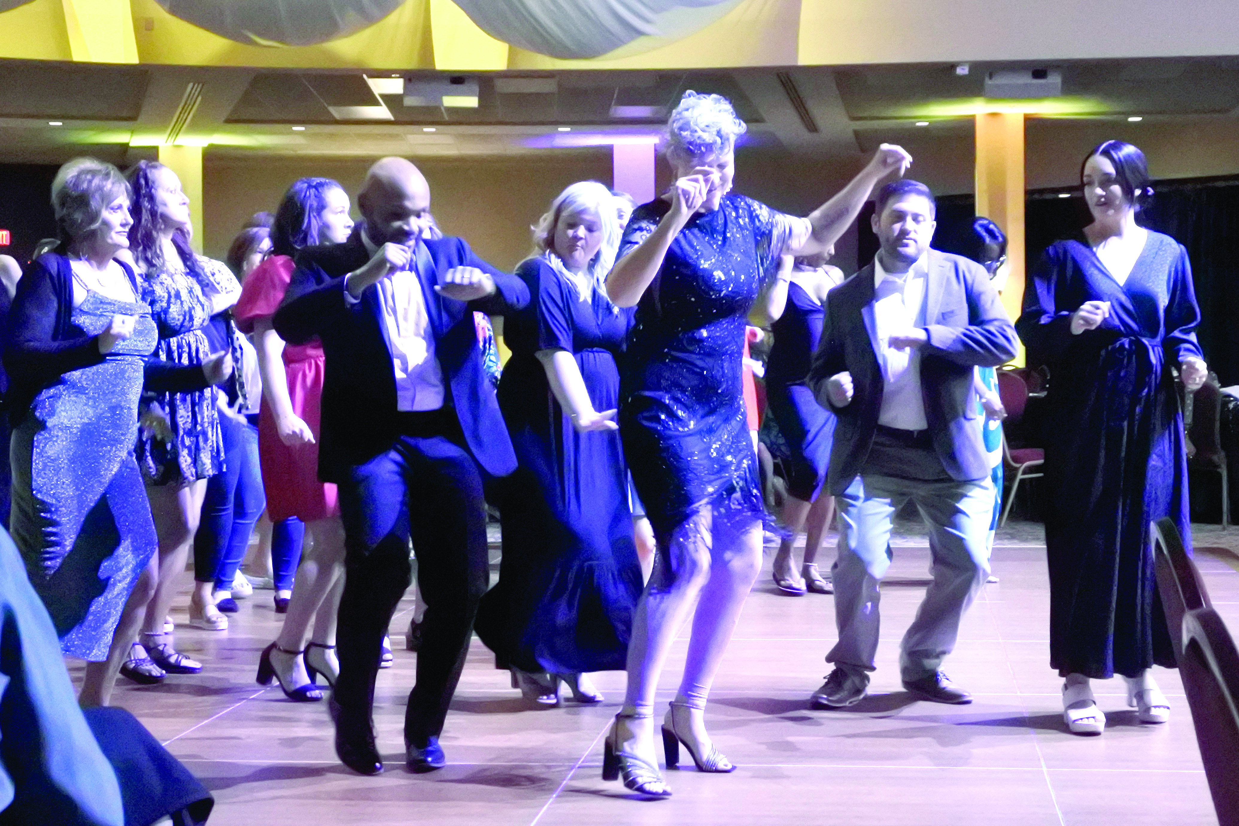 Attendees of the Shawnee Rotary Dancing With Sahwnee enjoyed some line dancing. Pictured from left are Kaye Steele, Pottawatomie Go Executive Director John Bobb-Semple, Small Business &amp; Entrepreneurship Coordinator Cama Watts, Shawnee City Manager Andrea Weckmueller-Behringer, City of McLoud Mayor Daniel McClure, and his wife Stormy McClure. Counttywide &amp; Sun/Suzie Campbell