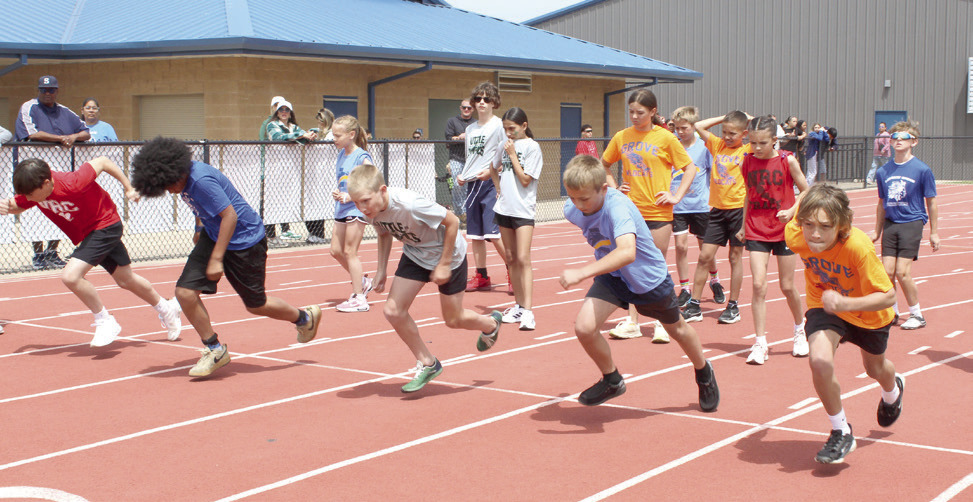 Shawnee sixth-grade boys from area independent elementary schools take off from the starting line in the Division II 100-meter dash during Kiwanis Little Olympics, held at Jim Thorpe Stadium on May 1. The independent schools in Division II include Grove, Pleasant Grove, South Rock Creek, North Rock Creek and Liberty. Photos by Natasha Dunagan, Countywide & Sun. See all our photos from the event by clicking on the camera banner ad below.