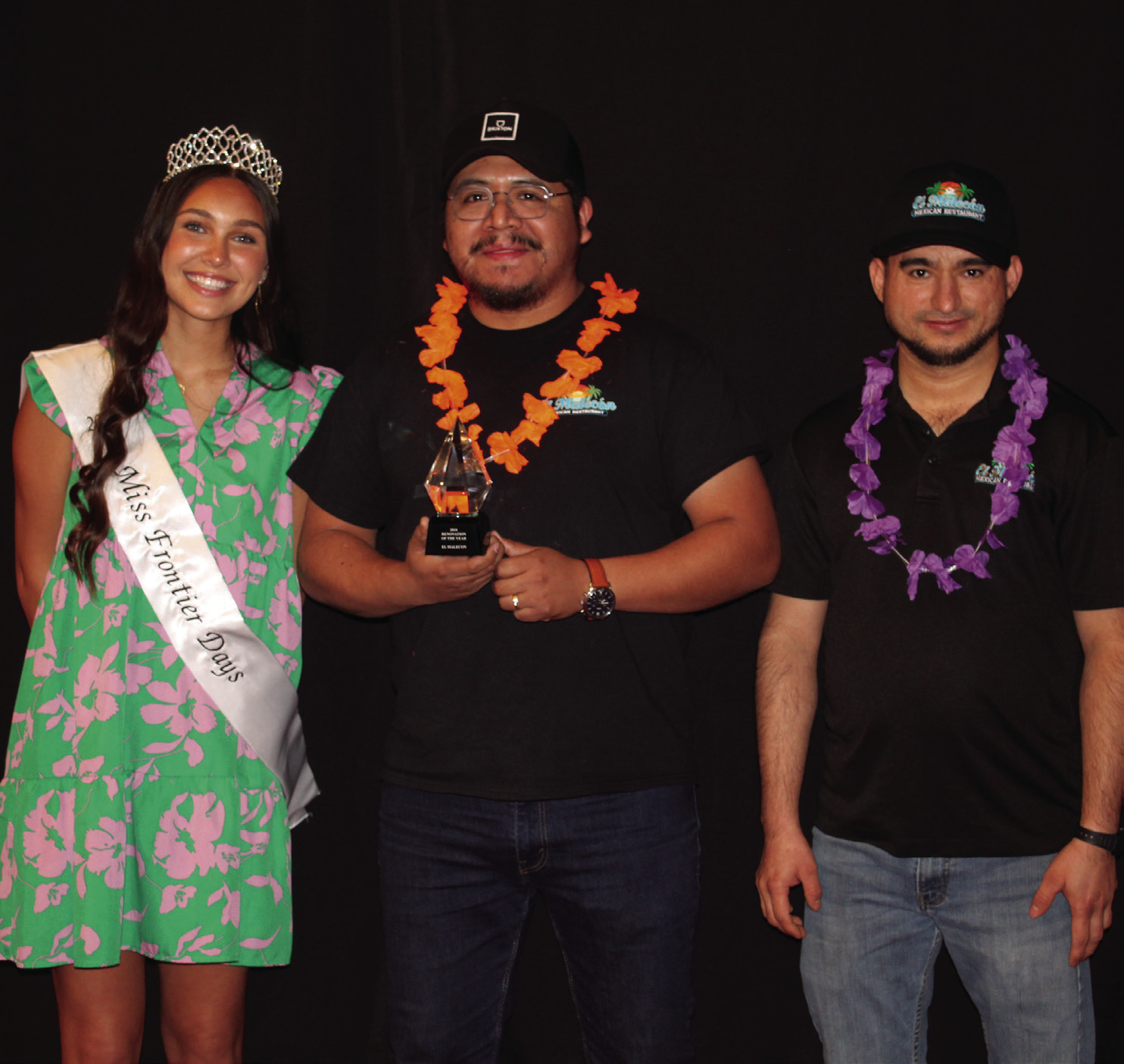 Miss Frontier Days Jalee Meyers poses with Marco Villa and Miguel Ramirez, with El Malecon, who received Business Renovation of the Year during the Tecumseh Chamber of Commerce Annual Meeting & Awards Banquet, held at the Grand Casino Hotel and Resort on Nov. 21. File photo