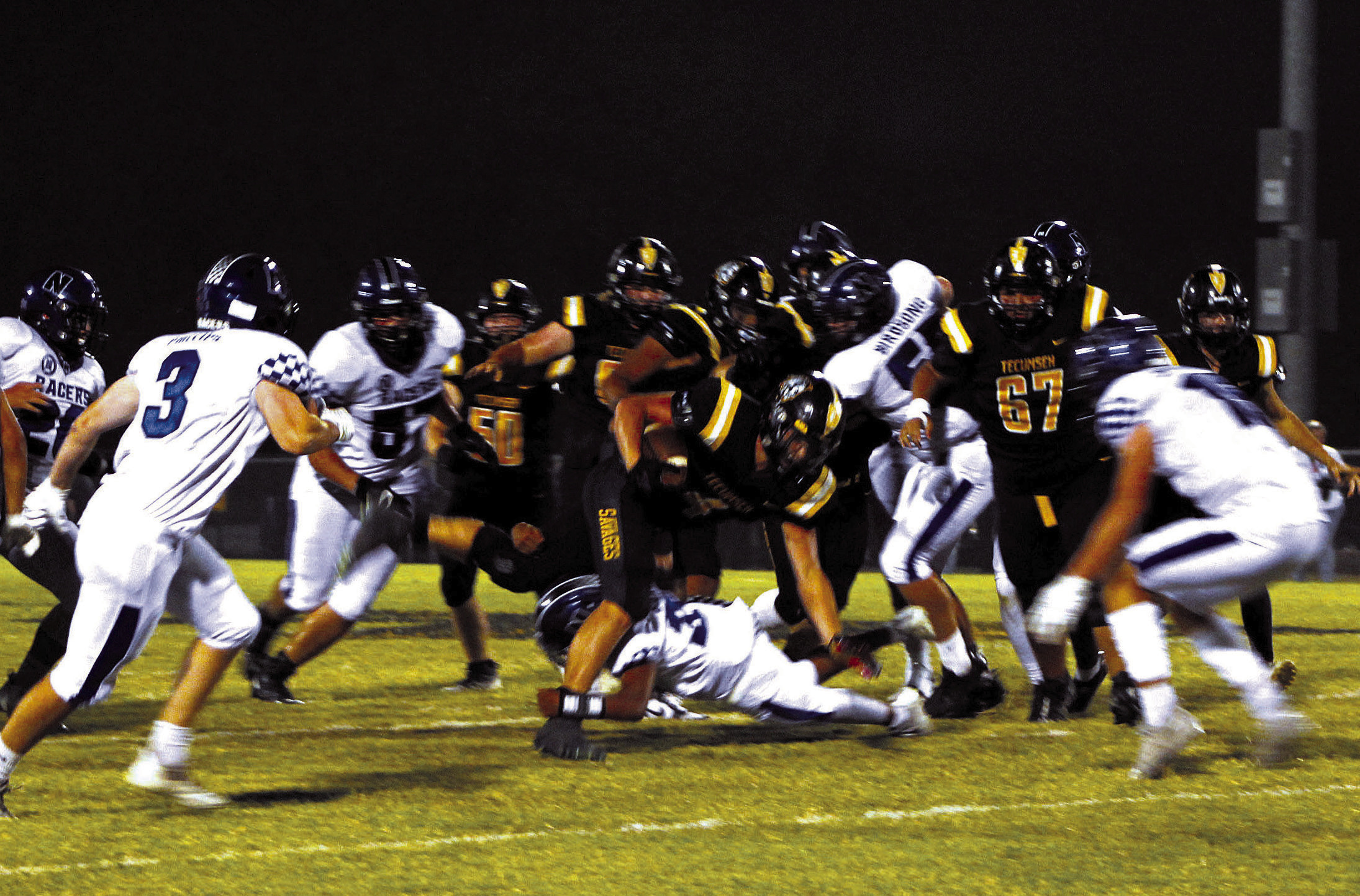 Tecumseh senior Garrett Chaffin breaks away from a tackle to sprint to the end zone during the second quarter of the home game against Newcastle on Sept. 23. The Savages lost 7-35. Countywide &amp; Sun/ Natasha Dunagan