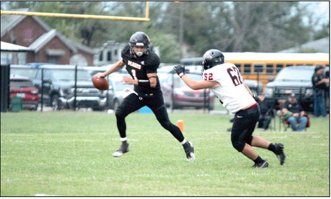 Maud sophomore Trenton Marshall sidesteps an Alex player as he shields the ball during the season-opening home game on Sept. 5. The Tigers lost, 6-52. Natasha Dunagan, Countywide &amp; Sun